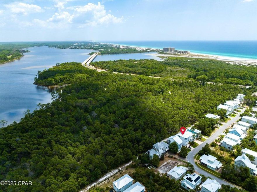 Live the Luxurious Coastal Lifestyle with 3 Public Beach access just steps away from your very own Beach House! Imagine owning a masterpiece of modern design nestled in the heart of coastal splendor, where you can enjoy not just the beauty of the beach, but also get paid to own this exquisite residence! Welcome to your dream home in Grande Pointe, Inlet Beach, where the allure of sugar sand beaches starts with three remarkable public access points just steps from your doorstep!Turn-Key Luxury Awaits You. This enchanting home promises a unique blend of tranquility and opulence, making it the perfect sanctuary for relaxation or entertaining. Step into your personal paradise, where upscale living and natural beauty come together seamlessly.A Grand Entrance to Effortless Elegance.  Upon enter you'll be captivated by the grandeur of the open-concept layout, featuring soaring 10' and 12' ceilings that amplify the sense of space. An inviting grand foyer flows beautifully into expansive living areas, all thoughtfully designed with custom furnishings and exquisite window treatments that elevate your experience of coastal sophistication.Indulge in Your Primary Suite Oasis.  On the first floor, your luxurious primary suite serves as a personal retreat, complete with a spa-like ensuite outfitted with double vanities, a lavish shower, and a generously sized walk-in closet, ensuring every storage need is met. Sleep peacefully on a large custom king-sized bed framed by stylish decor, where comfort meets chic.Culinary Bliss Awaits in Your Gourmet Kitchen The heart of this stunning abode lies within the gourmet kitchen, boasting a professional-grade gas 6-burner cooktop, a convenient pot filler, a vast island perfect for culinary creativity, and a spacious walk-in pantry. Hosting friends and family will be a delight with your built-in coffee/wet bar, ensuring you're always prepared for unforgettable gatherings.Versatile Living Spaces for Every DesireIn need of flexibility? Your home features a cozy bunk room on the second floor, while a bonus loft on the third floor can transform into a family room, office, play area, or peaceful reading nook. Tailor these versatile spaces to fit your lifestyle and personal tastes!Outdoor Bliss Beckons You Embrace the coastal air and breathtaking views from the large balconies on both the 2nd and 3rd floors, perfectly designed for outdoor entertaining or capturing magical sunsets. Create treasured memories with loved ones in your beautifully appointed outdoor spaces--each moment is an opportunity for joy.Unrivaled Location in Coastal ParadiseLiving in Grande Pointe means you're immersed in everything coastal bliss has to offer. With easy access to South Walton's largest public beaches, located just half a mile away, plus the vibrant shops and restaurants of 30A and local gems like Rosemary Beach and Aly's, your beach days are just a stroll away! Nature lovers will relish the proximity to Camp Helen State Park, where picturesque trails and multiple beach accesses await your exploration.Luxurious Community AmenitiesAs a resident of Grande Pointe, indulge in exclusive amenities, including a serene lakefront heated pool, a community dock perfect for peaceful mornings by the water, and a classy clubhouse complete with a full kitchen for entertaining friends and family.Turn-Key Opulence Ready for You!This exquisite home comes fully furnished, allowing you to dive straight into the coastal lifestyle of your dreams. Imagine living in a property that not only exudes luxury but also pays you back through lucrative short-term rental possibilities! Don't Miss Out on This Investment Opportunity!Your chance to own a luxurious coastal haven in Grand Pointe, Inlet Beach, awaits! Whether seeking a personal escape or a profitable investment, this dream home is truly a jewel that won't last long on the market.