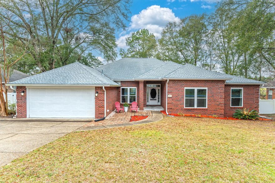 Price reduction and $5k towards closing costs!! Seller is motivated!Straight line to Duke Field, Eglin & Hurlburt AirForce bases. Blissful backyard with 96 ft of waterfront on the lake.  Relax in the den and enjoy the gas fireplace as you gaze out back of the home which mimics a wall of glass. Can you say butterflies & fireflies. The well-appointed kitchen flows into the den with a large island bar perfect for casual meals. Steel Frigidaire French door refrigerator, smooth top electric stove & all the cabinet space you could want. All the bedrooms are well sized with a primary ensuite that includes a jetted garden tub, a separate walk-in tiled shower & closet. High impact windows and sliders installed 2022-2023, roof 2023, interior newly painted, and hot water heater 2019, HVAC 2022! This home was well maintained and cared for!