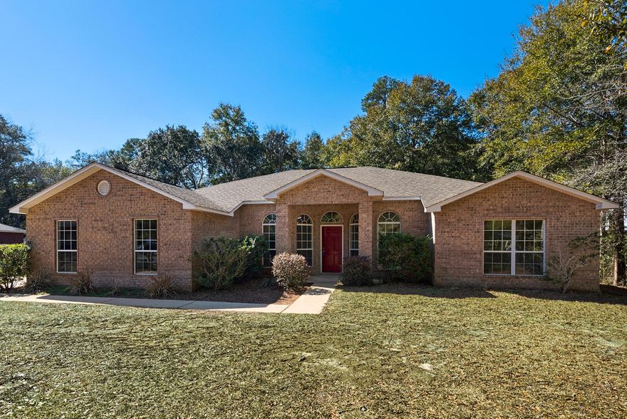 This spacious family home sits at the end of a cul-de-sac, side entry garage, covered front porch and open wooden deck surrounded by wooded perimeter. Waterview Cove is a bayfront community located on the north shore of Alaqua Bayou and the Choctawhatchee Bay. Enter the home and you'll be impressed with the open and airy floorplan. There is a large living room and also a formal dining room. The kitchen and breakfast nook have beautiful wood flooring as well as stainless steel appliances, kitchen island with outlet, plenty of raised panel maple cabinets, with a Corian island. The split floor plan boasts 4 bedrooms and an office.