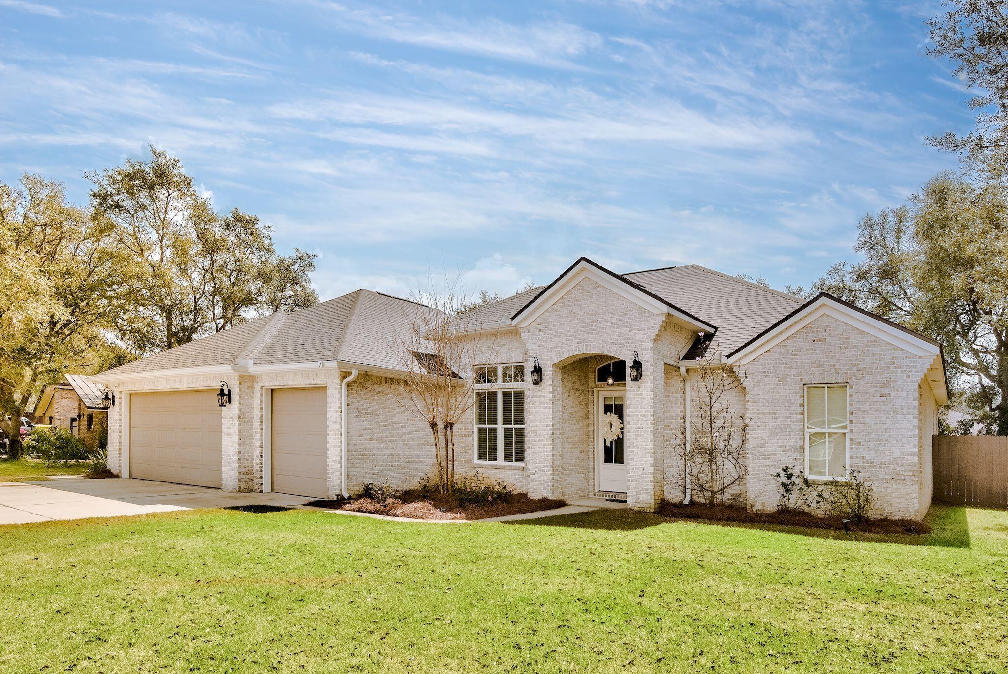 Rare find in the much sought after neighborhood of Indian Bayou in the heart of Destin. This is a 5 year NEW custom built home with hurricane windows and doors on almost a 1/2 acre lot. Great for entertaining with it's open floor plan. The chef's kitchen has granite countertops, 5 burner gas cooktop, and stainless steel appliances. The primary en-suite has been designed with the sleeping area separate from the large bath and his and her walk-in closets. It also has a guest en suite with a private bath and walk in closet. The formal dining area along with a breakfast nook are a must when entertaining and/or for holiday celebrations. Enjoy your covered patio while watching your favorite TV show or just relaxing outside. The side and back yards are completely enclosed with a 6 ft. privacy