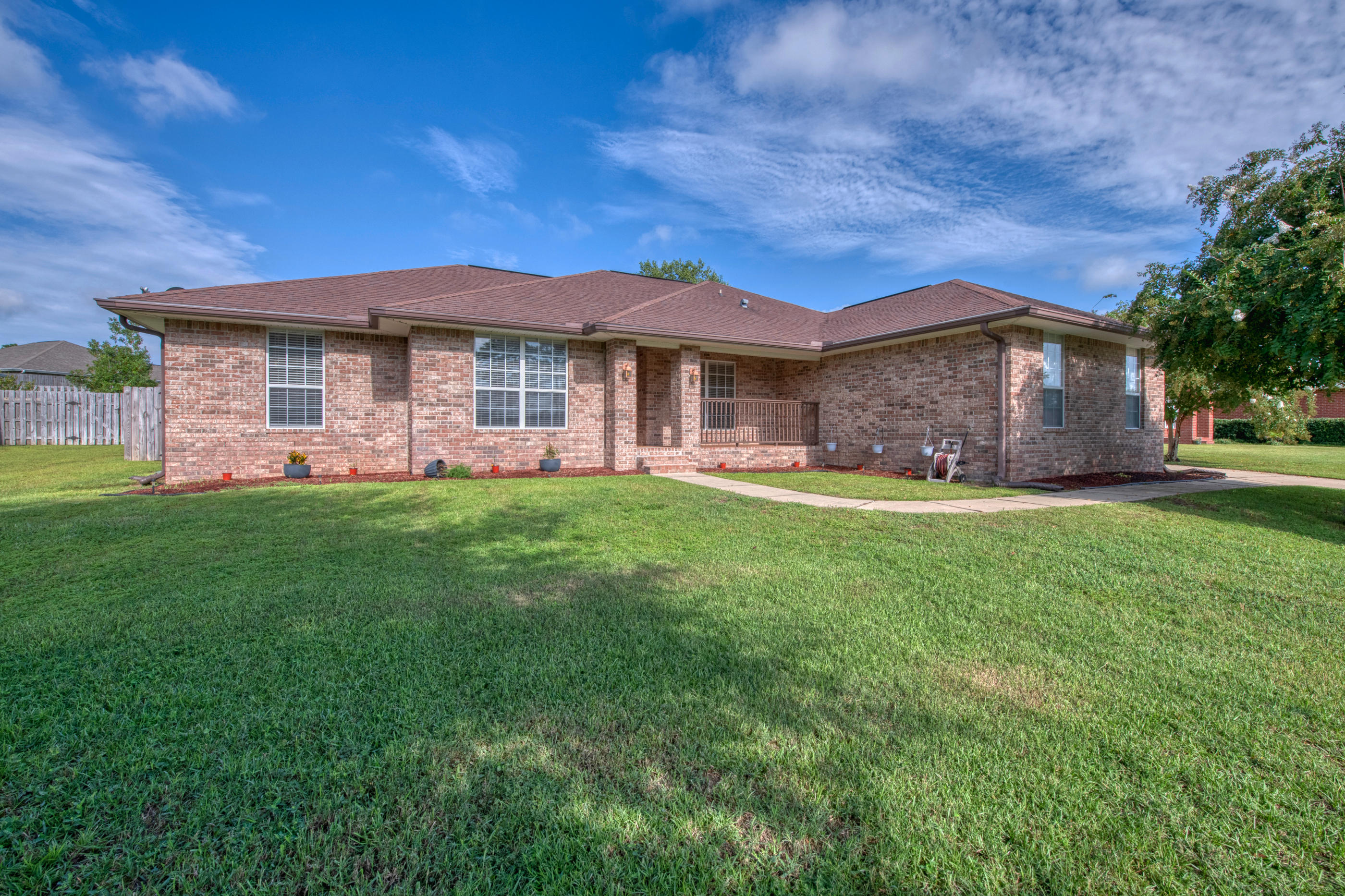 South of I-10, convenient to Duke Field, 7th Special Forces, and Eglin. Foyer opens to a spacious living room which has cathedral ceilings views of the backyard. Living room is flanked by the dining room and study, which has French doors for added privacy. The kitchen has all appliances, a breakfast nook, pantry, along with a 2nd Pantry in the hall just outside the Kitchen. Master bedroom has his and her sinks and over-sized vanity, his and her walk-in with custom built-in organizers, a garden tub and extra linen closet. On the opposite side of this split bedroom designed all brick home, you will find bedrooms 2, 3, and 4 and the 2nd full bathroom. Side entry 2 car garage. The seller is providing a 1-year American Home Shield warranty!