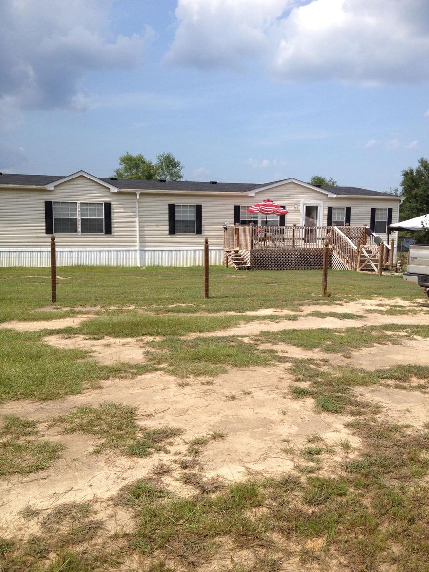 Priced below appraised value! Clean 2312Sqft, built 2012, 4 bedrooms, 2 bath, 2x6 construction mobile home with 20 Acres of land and a spring feed creek. 10 x 22 deck coming off the front. A large pole barn/work shop and a chicken coop. Deep fresh water 4'' well drilled over 500'for your drinking water.Owner has set all the corner post with 75% of the fence completed around the property. Area is known for the wild life, deer, and turkey. Large parcels of land boarders the 20 Acres on the north and west. If you're looking to relax and a quite place to live don't miss out.