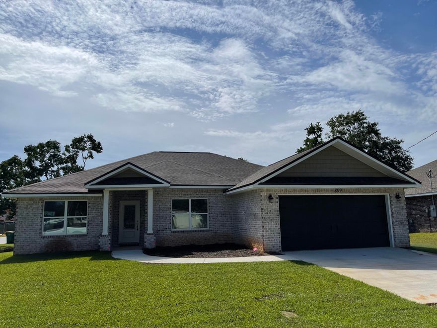 NEW GORGEOUS ALL BRICK HOME w/COVERED FRONT PORCH NESTLED IN GREAT LOCATION...just a few miles to Hurlburt AFB & Navarre Beach. 
KITCHEN: Level 3 Granite counters, White shaker style cabinets w/soft close drawers, Stainless appliances. Pantry. 
MASTER BATH: Level 3 Granite counters, dual sink, large custom tiled shower w/seamless glass door, Large Double shelved walk-in closet. MASTER: tray ceilings, crown, puck LED lights, ceiling fan. 
MORE FEATURES: PREMIUM Vinyl wood plank floors. 12x24 tile in baths. Office/Bedroom LVP flooring, 10' ceilings, tray ceiling in Living rm, 3 Additional Bedrooms carpet. Covered back porch, Ceiling fans w/light, Hurricane Fabric protection, Irrigation System w/well, Pull down attic, upgraded light/fixtures, Laundry rm cabinets, Architectural Shingles & more