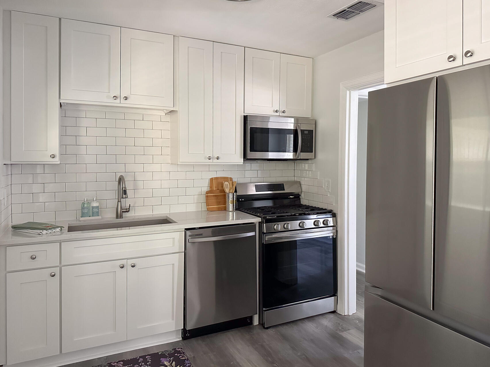 Step into this beautifully remodeled home nestled within the Fort Walton Beach City Limits. This charming residence features three bedrooms and a well-appointed bathroom, all recently revamped to perfection. The makeover includes fresh paint, brand new flooring, and a modern kitchen complete with elegant white shaker cabinets featuring soft-close mechanisms, a stainless steel gas stove, dishwasher, refrigerator, and stylish new lighting fixtures.Experience the best of indoor and outdoor living with a spacious covered and screened-in rear porch. Whether you're entertaining guests or simply relaxing with your loved ones, this inviting space offers the ideal setting for year-round enjoyment. Don't miss the chance to make this delightful home yours!
