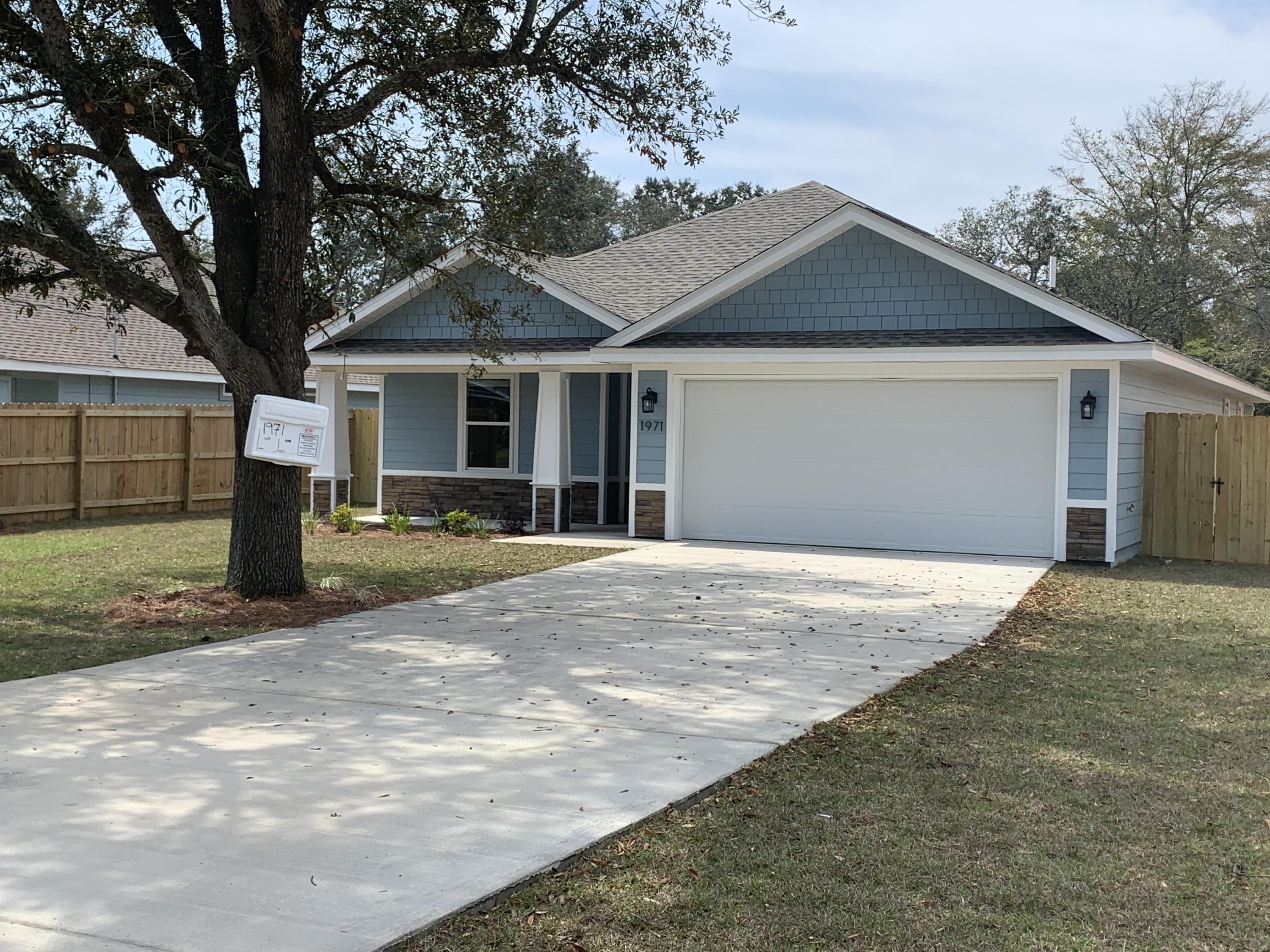 NEW CRAFTSMAN Custom Built Home in EAST NAVARRE~This luxurious 3 bed/2 bath floor plan is under construction... ~Great Location within walking distance to the Waterfront Navarre Park..and easy access to Navarre Beach, shopping and Hwy 98 to Hurlburt Field AFB.This Stunning Custom Home offers trend setting features~Greeted by a walk in foyer sweeping through to your open floor plan ~Large kitchen enjoying Shaker custom cabinets with crown molding, beautiful quartz counter tops~Under mount sink~Samsung S/S appliances including Refrigerator.Huge walk in pantry and separate utility room ~Center Island with pendant lights ~open flow to the family room, Wood look flooring through the foyer, main living area, with tile in the laundry and bathrooms.Large Master with trey ceiling & ceiling fan. Master bath offers a step in tub/shower~Quartz double vanity with rectangle under-mount sinks ~ picture frame mirrors & matte black fittings. Additional Bedrooms are a good size with double closets and ceiling fans~Home has front and back covered porch and is situated on a fully grassed lot and fenced for privacy.Hurricane fabric shield protection and dimensional shingle roof for lower insurance premium. Upgrades throughout bull nose corners , recessed lighting ,framed mirrors, deluxe lighting package, garage door remotes, attic drop down stairs~ to name a few......Call today for further information.