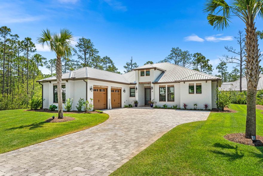 Escape to your own oasis within the confines of Seclusion Bay, where privacy meets luxury. Nestled within this gated community, this home sits on a coveted 1/2-acre lot and offers a generous 2,544 square feet of living space. Boasting 3 bedrooms, 3 bathrooms, a dedicated office, and a  2-car garage, this residence is designed for both comfort and style.