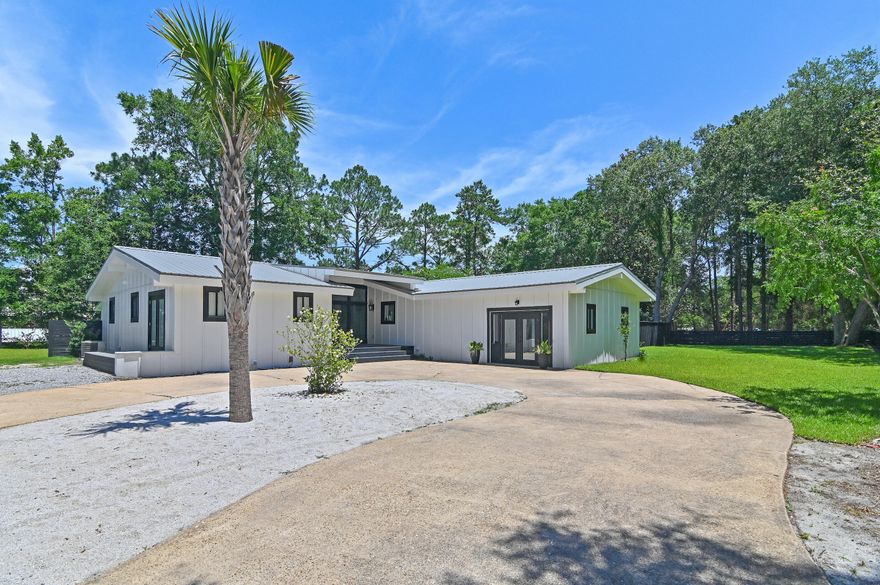 Welcome to 128 Ricker Avenue, an exceptional canal-front retreat offering 150 feet of water frontage across a rare double lot in sought-after Point Washington in Santa Rosa Beach. With a private dock, boat slip with a lift, and spacious waterfront deck, this property is tailor-made for boaters and outdoor enthusiasts alike. Designed for both everyday living and memorable entertaining, the home showcases plenty of parking, a large open-concept living and dining area anchored by a beautifully appointed kitchen--all enhanced by floor-to-ceiling windows that frame sweeping water views and flood the interior with natural light. A wrap-around porch connects seamlessly to a private pool and back yard oasis, as well as the dock and waterfront deck area, providing multiple spaces for entertaining. The main home offers 3 bedrooms and 3.5 bathrooms, thoughtfully arranged with en-suite bathrooms for comfort and privacy. A versatile converted garage, fully heated and cooled with a full bathroom and its own private laundry connections, offers the ideal flex space for a guest suite, home office, or fitness room.
Spend the day by your private pool, relax on the canal front deck or launch your boat and kayak and explore the nearby Choctawhatchee Bay and Gulf waters. When you're ready for a change of pace, the world-class beaches of 30A are just a short drive or bike ride away (3.5 miles), along with renowned dining, shopping, and entertainment options.  