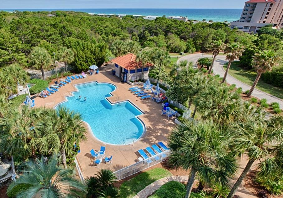 Imagine yourself sitting on your balcony listening to the sounds of nature coming from the woods of Four Mile Village, while, just outside your door, you have all that Tops'l Beach and Racquet Resort has to offer! This is the best of all worlds! This two bedroom condo has been lovingly updated with granite and tile including tile tub surrounds. Being sold Partially Furnished and As Is. It will be ready for you to make your own! Come see this gem today! The Summit HOA dues are $468 a month and the Tops'l Master dues are $285.00 a quarter. There was a special assessment for a new roof. The amount for the two bedroom is $8315.00 if payed in full, This assessment has been paid in full by the owner.