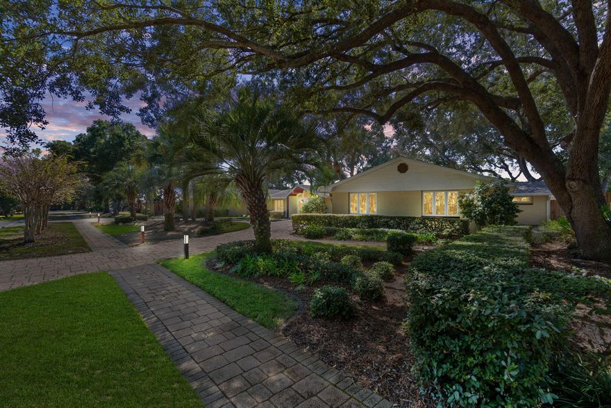 From the moment you step inside this fully renovated designer home, you'll be captivated by its exquisite attention to detail & sophisticated high-end finishes throughout. A stunning foyer with mosaic tile compass inlay incorporated in marble flooring, vaulted ceilings & gorgeous chandelier set the stage for the elegant living spaces beyond. An expansive main living area features bamboo flooring, dramatic vaulted ceilings with cypress beams, striking marble fireplace & 2 built-in travertine display niches with glass shelves. Formal dining room is graced by 2 Waterford crystal chandeliers, overlooking a lush landscaped backyard, heated pool & spacious paver entertaining areas. Walls of windows throughout offer natural light & provide sweeping views of the manicured front grounds & circular drive. The chef's kitchen is a true showpiece, showcasing custom cabinetry, granite countertops & Spanish tile flooring. 5-burner gas cooktop, gas oven, 4-door refrigerator & pantry with bamboo shelving. Kitchen offers bar seating & opens to a dramatic great room with cypress ceiling beams, a granite-clad gas fireplace & a sunroom-style breakfast area with pool and garden views. A full bath with tile flooring, granite shower & granite countertop vanity are easily accessed from pool. Spacious laundry room with Affinity washer & dryer, utility sink & abundant cabinetry connect to the kitchen & oversized 2-car garage with cabinets & a storage room. Elegant primary Suite is a serene retreat, featuring travertine flooring, dual ceiling fans, walk-in closet & French doors leading directly to backyard pool. Adjoining private office with custom mahogany built-ins provides the perfect space for remote work or quiet reflection. Luxurious primary spa-like bath with marble flooring & dual vanity countertops, marble walk-in shower with 6 massage heads & 2 large closets. 2 beautifully appointed Guest Suites each featuring their own tiled en-suite bath, finished with marble & designer glass accents & 1 highlighted by a Swarovski crystal chandelier. Spacious backyard private sanctuary designed for both relaxation and entertaining complete with mature tropical landscaping, outdoor lighting, built-in stainless steel grill with dual burners & direct access from master suite & breakfast area. Located just steps from the Bay, this extraordinary home offers a rare combination of luxury, comfort & refined design - perfect for elegant living & effortless entertaining. Hurricane rated windows & doors. Indian Bayou Community has low HOA fees & sidewalks throughout the Community. Indian Bayou Golf & Country Club is a semi private Golf Course featuring a Bar & Grill. All information deemed to be correct, but buyers agent to verify all data & information important.

