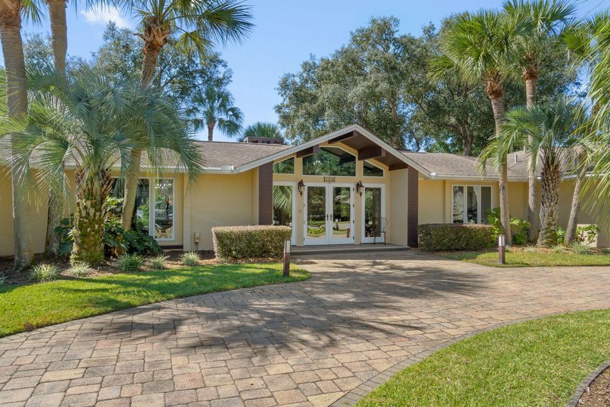 From the moment you step inside this fully renovated designer home, you'll be captivated by its exquisite attention to detail & sophisticated high-end finishes throughout. A stunning foyer with mosaic tile compass inlay incorporated in marble flooring, vaulted ceilings & gorgeous chandelier set the stage for the elegant living spaces beyond. An expansive main living area features bamboo flooring, dramatic vaulted ceilings with cypress beams, striking marble fireplace & 2 built-in travertine display niches with glass shelves. Formal dining room is graced by 2 Waterford crystal chandeliers, overlooking a lush landscaped backyard, heated pool & spacious paver entertaining areas. Walls of windows throughout offer natural light & provide sweeping views of the manicured front grounds & circular drive. The chef's kitchen is a true showpiece, showcasing custom cabinetry, granite countertops & Spanish tile flooring. 5-burner gas cooktop, gas oven, 4-door refrigerator & pantry with bamboo shelving. Kitchen offers bar seating & opens to a dramatic great room with cypress ceiling beams, a granite-clad gas fireplace & a sunroom-style breakfast area with pool and garden views. A full bath with tile flooring, granite shower & granite countertop vanity are easily accessed from pool. Spacious laundry room with Affinity washer & dryer, utility sink & abundant cabinetry connect to the kitchen & oversized 2-car garage with cabinets & a storage room. Elegant primary Suite is a serene retreat, featuring travertine flooring, dual ceiling fans, walk-in closet & French doors leading directly to backyard pool. Adjoining private office with custom mahogany built-ins provides the perfect space for remote work or quiet reflection. Luxurious primary spa-like bath with marble flooring & dual vanity countertops, marble walk-in shower with 6 massage heads & 2 large closets. 2 beautifully appointed Guest Suites each featuring their own tiled en-suite bath, finished with marble & designer glass accents & 1 highlighted by a Swarovski crystal chandelier. Spacious backyard private sanctuary designed for both relaxation and entertaining complete with mature tropical landscaping, outdoor lighting, built-in stainless steel grill with dual burners & direct access from master suite & breakfast area. Located just steps from the Bay, this extraordinary home offers a rare combination of luxury, comfort & refined design - perfect for elegant living & effortless entertaining. Hurricane rated windows & doors. Indian Bayou Community has low HOA fees & sidewalks throughout the Community. Indian Bayou Golf & Country Club is a semi private Golf Course featuring a Bar & Grill. All information deemed to be correct, but buyers agent to verify all data & information important.

