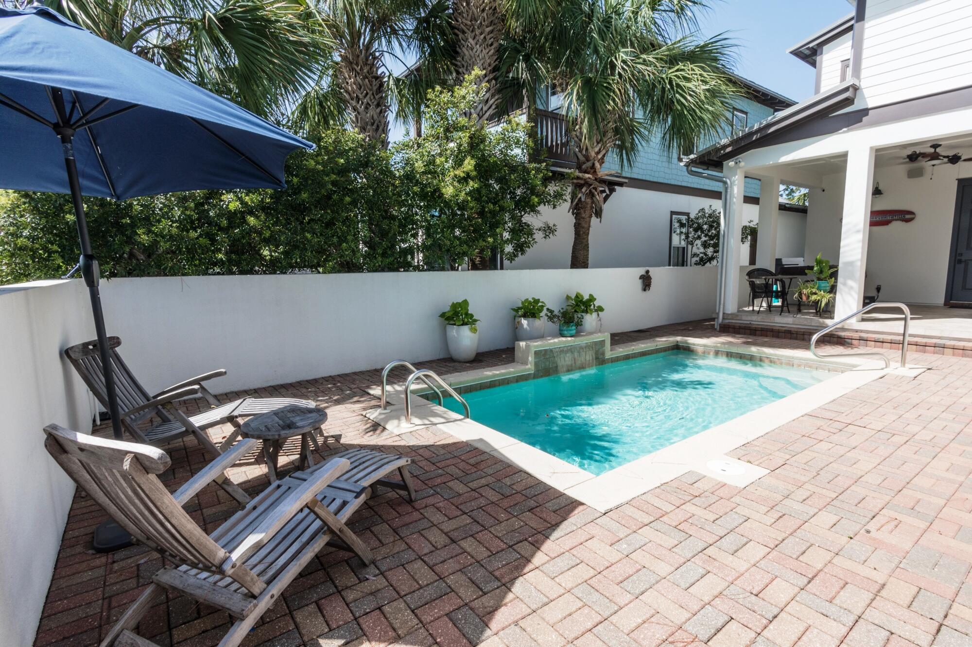 Beautiful custom-built two-story home on corner lot in Martinique! This coastal craftsman inspired 4 bedroom 4 and a half bath home features and amazing back yard with private plunge pool with water feature, outdoor shower, and covered lanai. Interior highlights include elegant open floorplan with 10' ceilings, crown molding and 18'' tile flooring throughout the first floor. The gourmet kitchen features solid oak cabinets, granite countertops, custom tiled backsplash, large pantry, and stainless-steel appliances, including a new gas stove. A spacious open living room with a fireplace and a wall of windows adjoins the kitchen on one side and on the other a beautiful dining room with wainscoting details. The first-floor master suite has hardwood flooring and a spacious en suite bath which includes a walk-in shower, granite countertop vanity and a soaking tub. There is also a door which leads out to the pool and lanai area.
The second-floor master suite has oak flooring, a private balcony and its adjacent bath includes double sinks in the granite vanity, a walk-in shower, whirlpool tub and "his-and-hers" walk-in closets.
There are two other bedrooms upstairs, each with a bathroom. The large upstairs lounging area features Brazilian Cherry hardwood floors and a large balcony overlooking the front yard.
The two-car garage is accessed from the side of the home and features built in shelving and a door to access the pool area. The home has a new upstairs complete HVAC system, and a new, extra-large water heater with a recirculating feature for instant hot water. Recently re-sodded yard and repainted exterior of the house with high quality Sherwin Williams paint. Windows are impact resistant and roof was inspected after Michael with no issues found.
Martinique is a gated community with lots of natural landscaping, ponds, walking trails and a community pool. This prestigious neighborhood is nestled on the east end of Panama City Beach in the Grand Lagoon area. This neighborhood is just 3 minutes from the Gulf of Mexico and the beautiful white beaches of the Emerald Coast and an easy walk to wonderful restaurants including Grand Marlin, J Michaels, and Captain Anderson's. Take a stroll to the docks to watch the fishermen bringing in their catch or to the weekend farmer's market in front of Captain Anderson's. Or enjoy the walking trails and local wildlife including deer, snowy egret, and wild heron and osprey.
All information and sizes are approximate, and buyer should verify if important.