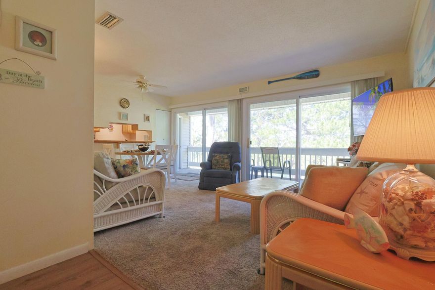 Fully furnished and rental-ready! This 2 bed, 2 bath unit features dual walk-in showers, a coffee bar, and carpet in most areas. Located in the private part of Gulf Terrace, this unit is clean, comfortable, and move-in ready and best of all has a beautiful view of the lake and green belts. Located in a well-maintained community with 3 pools, a tennis court, and grill/picnic areas--many of which have been renovated.  Just 0.5 mi to Big Kahuna's, 0.8 mi to Publix & Target, less than 1 mi to beach access, and 2 mi to Destin Commons. Great for short- or long-term stays! Buyer to verify all measurements and pertinent information. Schedule your private showing today.