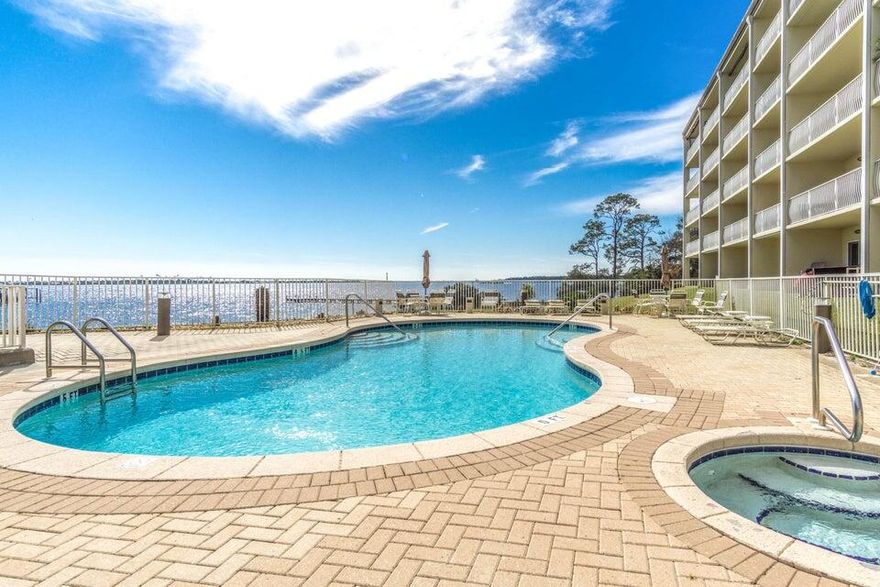 *PET FRIENDLY, GATED COMMUNITY, ACCESS TO SANTA ROSA SOUND, 2024 NEW AC/WD, WTRHTR, CARPET, PAINT, GARAGE DOOR OPENER & ELECTRIC CAR CHARGER!!!* This amazing end unit townhome offers an open floor plan for the living/dining & kitchen areas along with breakfast bar. Owner has provided a contemporary dining table with two bar stool chairs. Both bedrooms located upstairs with individual bathrooms too! ALSO, the garage floor has been refinished (check out the photos!).  The grounds feature a pool, hot tub recreational area that includes a grilling and picnic area overlooking the water. Enjoy fishing, kayaking, paddle boarding, or just take in the sunset! Owner allowing cats/dogs up to 50lbs fully grown.