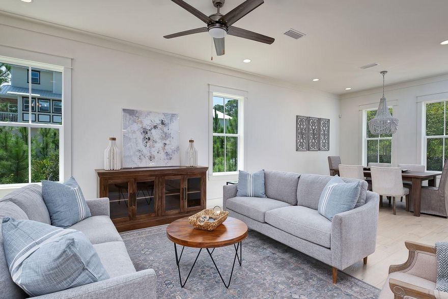 Property is under contract with kick-out clause in place. Exceptional proximity to the beach paired with an incredible naturalistic setting characterize this beautiful new construction home primely located in the tranquil beachside neighborhood of Treetop. Exemplary coastal construction and finely appointed design details define this five bedroom, five and a half bath property which offers gated access to the Seacrest beach neighborhood as well as a direct ingress and egress to highway 98 and an impressive three story vertical footprint with a desirable open floor plan that includes notable features such as dual master suites with cathedral ceilings, a gourmet chef's kitchen fully equipped for entertaining, coastal whitewashed hand scraped hardwood floors,