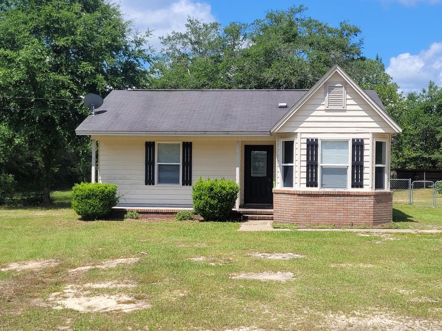 Calling all investors!! Charming 3 bedroom 2 bath located 10-15 minutes from Crestview off of Bill Lundy Rd. Large 1 acre lot with old growth trees. 1128 sqft of living space with 2 year old AC unit. Large shop plus an additional smaller yard building for tools and lawn mower storage etc. Roof had a leak and was patched but there is some water damage in the master bedroom and bathroom ceiling, so it will be sold AS IS. This home will not pass inspections due to the roof, CASH ONLY.