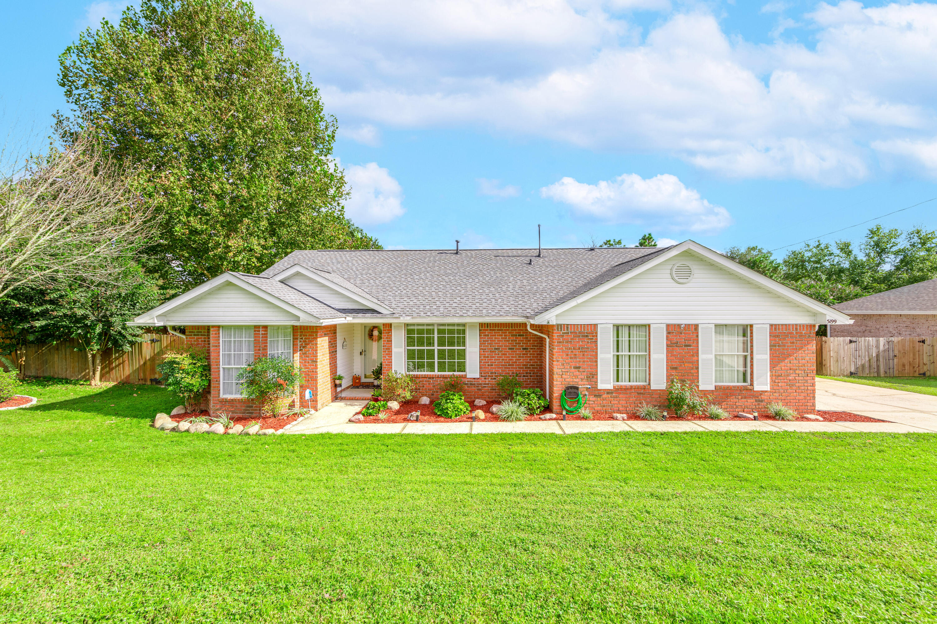 Updated home SOUTH of I-10 with quick access to schools, military bases, and all Crestview has to offer. Hardwood flooring throughout the house excluding tile in all wet areas. Gorgeous kitchen with stainless steel appliances, gas range, and granite countertops with modern backsplash and an under mount sink. Home has been freshly painted. Roof was replaced in 2020. Exterior features include a fully fenced backyard, grilling deck, sprinkler system, and drainage system.