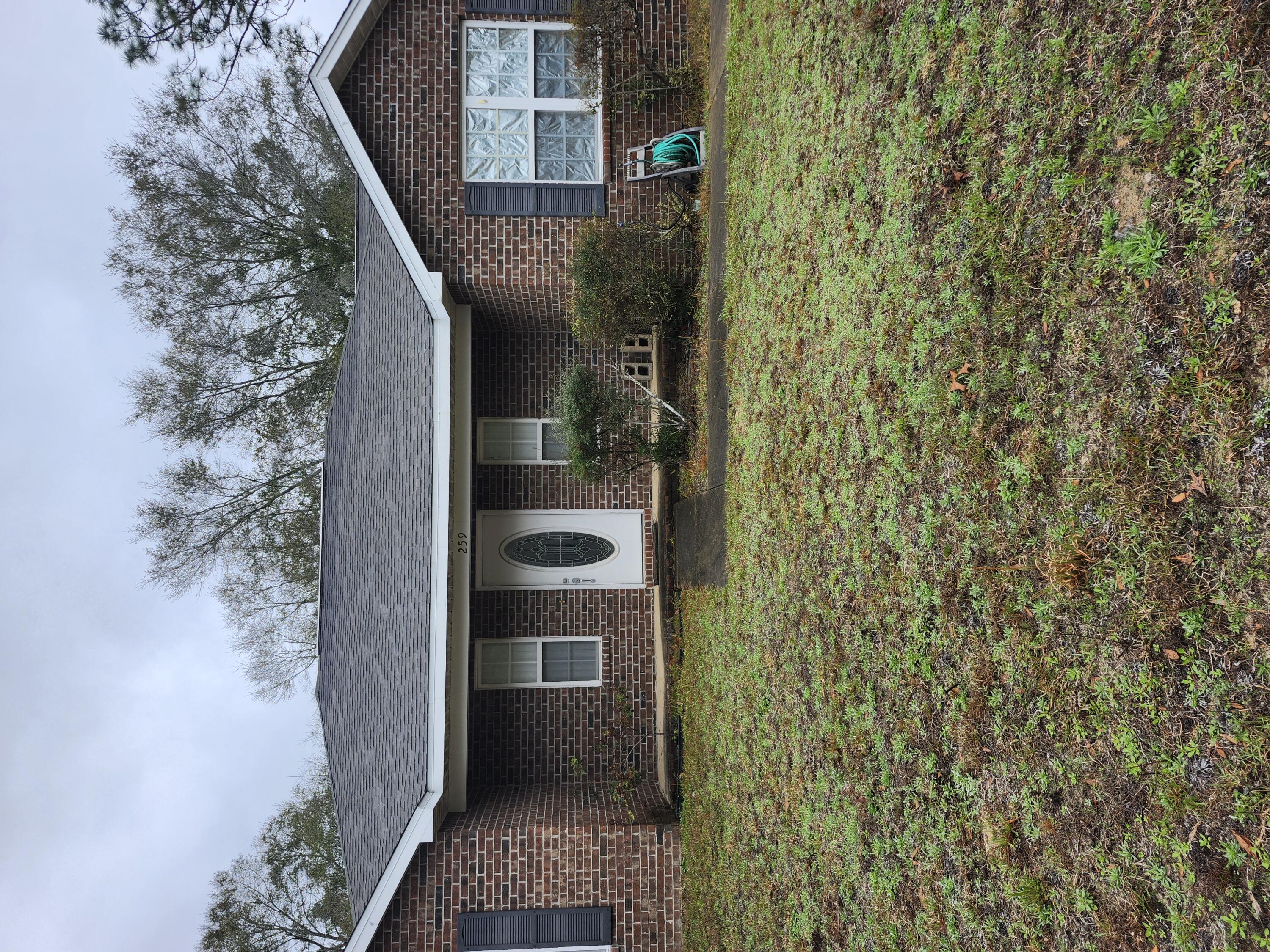 Priced for immediate sale! Seller is offering a generous $7,000 credit to buyers with accepted offer at closing. Don't miss this opportunity! Roof was inspected in 2022 by a licensed Roofing company and was in excellent condition with 10+ years of roof life at that time. Info to be verified by buyers due diligence. Letter from contractor is in docs with current insurance info. This beautiful brick home features a split floor plan with many options. Situated at the end of the road with a huge back yard you will enjoy privacy and very little traffic. Master bedroom features en suite and is on the opposite side of the house from the other 2 bedrooms. HVAC is 1 year old. Refrigerator does not convey with sale. Shed is of no value