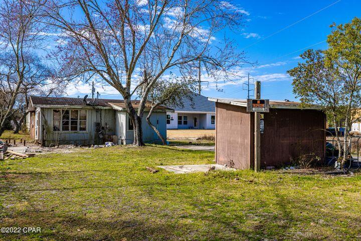 Nice building lot on the West end of Panama City Beach. Only Blocks to the beach; new subdivision is being built adjacent to lot. Wonderful location!! Close to Pier Park, Carillon Beach, the 30A corridor, and of course, the beach! Home and septic tank must be removed. This property has been condemned. It is the buyer's responsibility to do so.