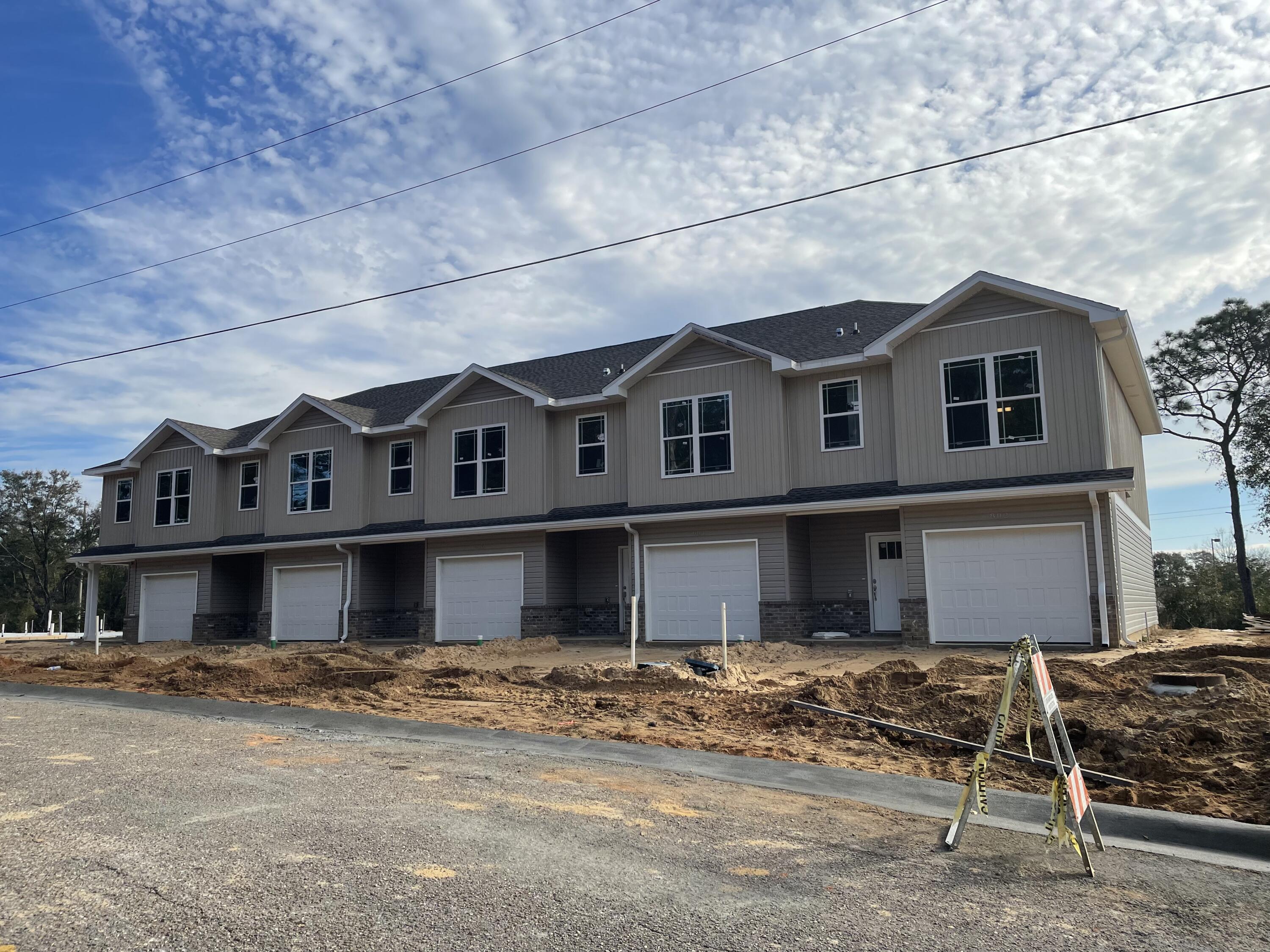 Available for move in beginning March 21st! Brand new 3 bedroom / 2.5 bath townhomes centrally located in Crestview. Open floor plan downstairs for easy entertaining. Granite counters tops, LVP throughout. No pets. Lawn maintenance included.