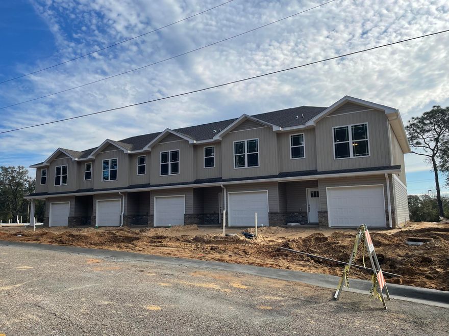Available for move in beginning March 21st! Brand new 3 bedroom / 2.5 bath townhomes centrally located in Crestview. Open floor plan downstairs for easy entertaining. Granite counters tops, LVP throughout. No pets. Lawn maintenance included.