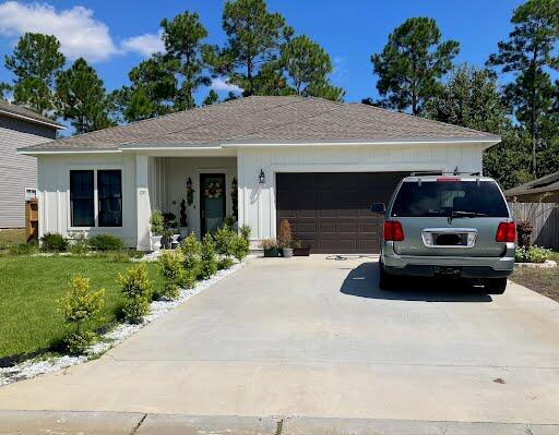 Stunning 2022 built home in quaint neighborhood in south Crestview! Owners were not expecting orders so soon, and now you have this amazing opportunity to rent a brand new home with gorgeous, contemporary finishes throughout. Nicely landscaped outside, inside this home features an open, split floorplan, beautiful tile flooring, neutral paint, & vaulted ceilings throughout. The living room is massive, and has French doors leading to an open patio overlooking trees out back in the privacy-fenced back yard. The kitchen is stocked with stainless appliances, including a flat cooktop stove, plenty of cabinet and counter space (soft-close drawers), a pantry, and island/breakfast bar. The large primary suite has its own en suite complete with a tiled, walk-in shower, jetted tub, double vanity, and