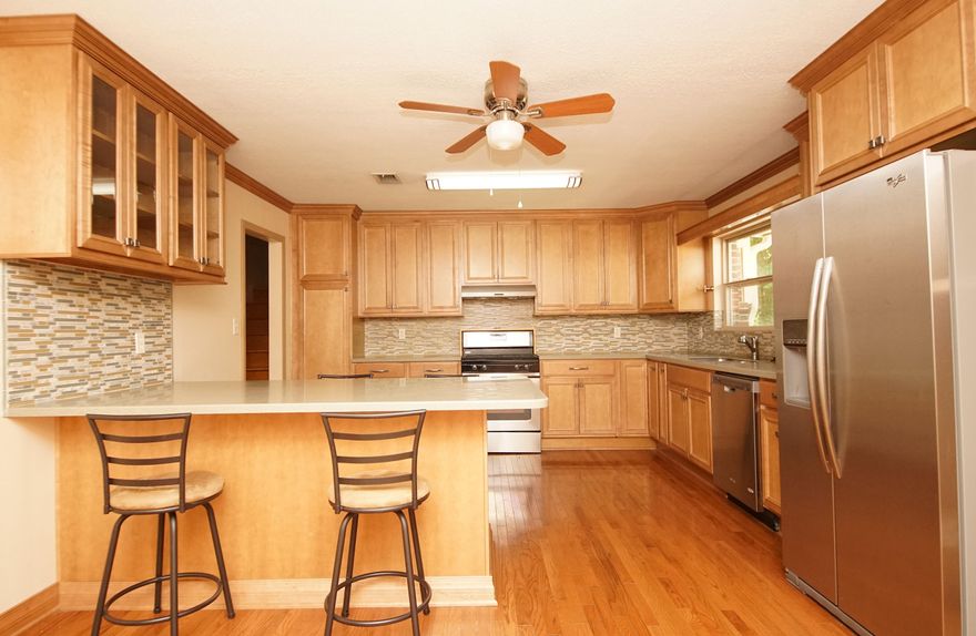 Major price reduction! Welcome Home! With its convenient location- close to beaches, shopping, bases, schools, along a sidewalk lined street, this home has it all! Gas stove in a fully updated kitchen with a remodeled floor plan that invites cooking and entertaining with a breakfast bar large enough to sit 8 (even 10!). Gorgeous maple, slam-proof cabinets with lots of space- including storage within the island, and stainless steel appliances on solid oak floors.Love our Florida weather? The expansive, privacy fenced backyard is ready for you! The screened porch and additional deck are unmatched! With two storage sheds and a special firewood chest that can be accessed from the screened porch or from the yard, you're always prepared