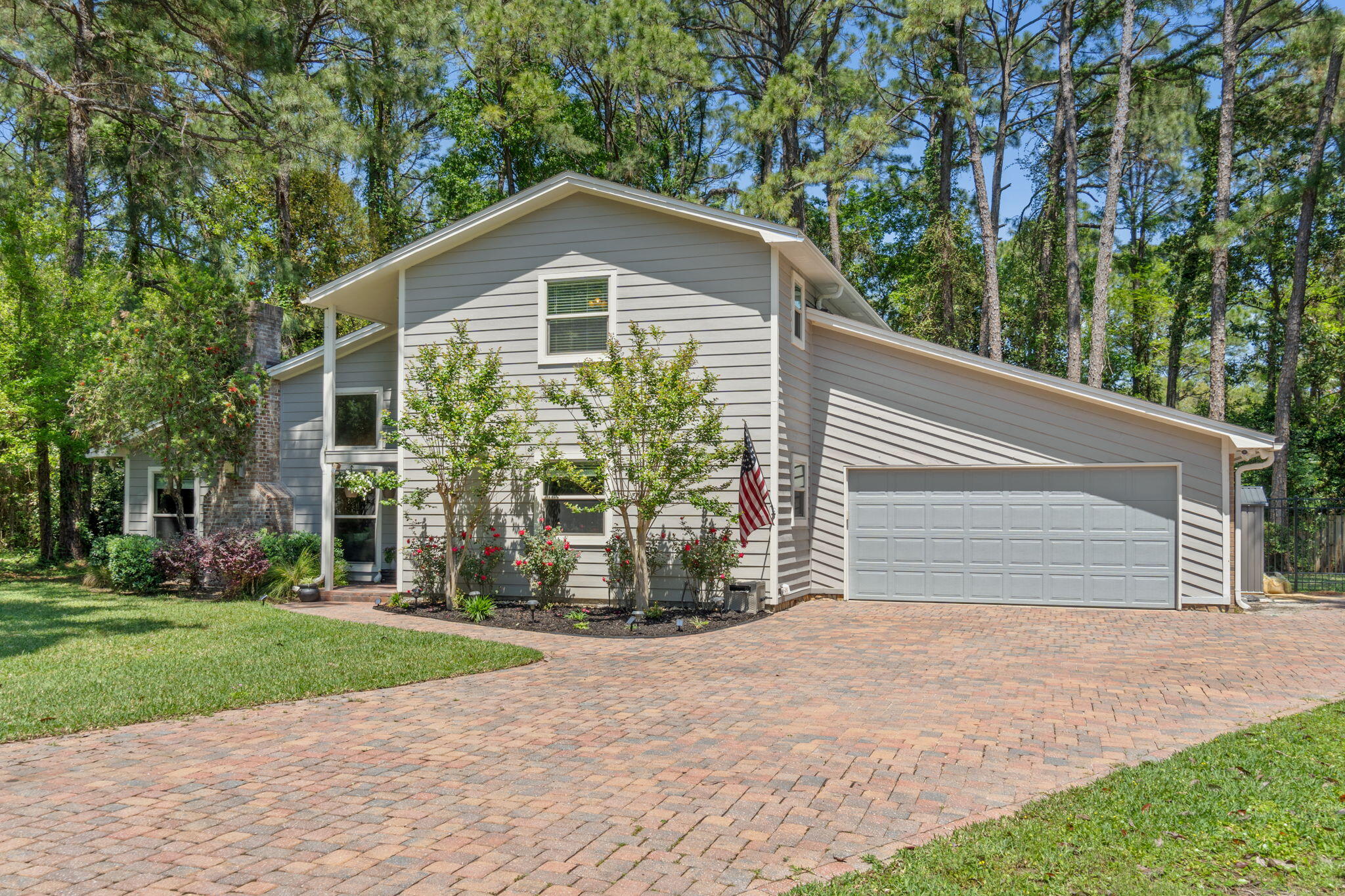*VA Assumable at 4.625%*Welcome to this beautifully updated residence nestled in a quiet cul-de-sac in the highly desirable Bluewater Bay community. Situated on an oversized lot, this home boasts exceptional curb appeal with neutral gray Hardie board siding, a custom paver driveway, impact glass windows, and a fully fenced backyard featuring a unique dog run area. Step inside to discover a spacious and inviting interior with soaring vaulted ceilings, neutral paint tones, and an expansive living area centered around a cozy fireplace. The heart of the home is the show-stopping, fully renovated kitchen, complete with custom Kraftmaid cabinetry featuring pull-out shelving, premium granite countertops, a striking custom range hood, Kenmore Elite stainless steel appliances, island outlets, a pot filler by the stove, and elegant travertine flooring.

Adjacent to the kitchen, a versatile Florida room/flex space offers a seamless transition to the serene backyard, which is beautifully landscaped with mature vegetation for added privacy.

The home features two generously sized bedrooms on the main floor, along with an updated full bath showcasing a large tiled walk-in shower with glass enclosure, dual vanities, and modern fixtures. A convenient laundry room leads into the oversized two-car garage.

Upstairs, the private primary retreat awaits, complete with a spa-inspired en suite bathroom featuring a luxurious walk-in shower with a rainfall showerhead, a deep soaking tub, dual vanities, and ample storage. Enjoy morning coffee or evening relaxation on your private screened-in porch. An additional upstairs bedroom also includes its own en suite bath with a walk-in shower and granite-topped vanity.

Additional highlights include beautiful laminate wood flooring throughout, a newer HVAC system, a 2022 roof and water heater, and a sprinkler system on a private well.

This home truly combines luxury, comfort, and functionalitydon't miss the opportunity to make it yours!