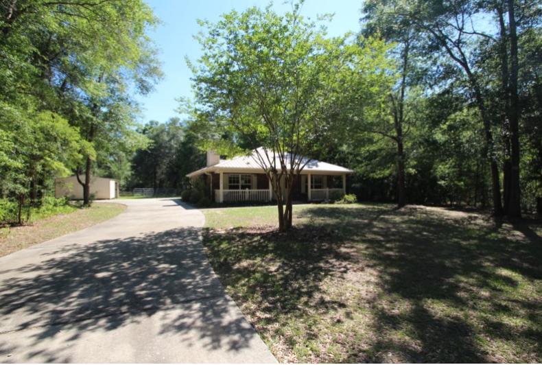 Real Estate Owned REO. This is a horse enthusiast dream with the main feature of this one acre property being the backyard. This beautiful property is designed to house Show Horses. The quarter acre pasture has a single loafing shed for weather protection and the other having 2 loafing sheds with a 60x70 ''lighted'' riding paddock, stable with two digitally timed stalls (10x10 and 12x12), for keeping show horses in short coat all winter. Hay Shed (10x10) with attached tacking shed. The storage shed is approx. (12x16) with electricity and a carport. Sitting on the other part of this one acre property is the 2 bed/ 1 and a half bath home. Living room includes ceramic tile fireplace surrounded by built-in book cases. Call to take a look today.