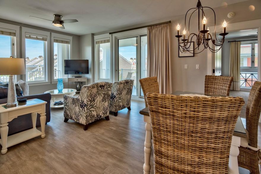 START LIVING THE RESORT LIFESTYLE YOU'VE DREAMED OF. Fantastic newly renovated condo in the heart of The Village of Baytowne Wharf W/$33,000 ANNUAL RENTAL INCOME! Ideal corner location overlooking the activities on Market street near the events Plaza but NOT over plaza so quieter & more private. Imagine living or vacationing in this charming pedestrian village w/fantastic restaurants & shops, events, family entertainment & nightlife just steps away. Offering true golf cart community living, tennis, multiple Golf courses, waterfront activities & Grand Blvd,just outside the resort gates w/add'l shopping, dining & entertainment are all accessible without traveling on Hwy 98. This home's large wrap around balcony provides plenty of outdoor living space, a peek of the Bay & a birds eye view..