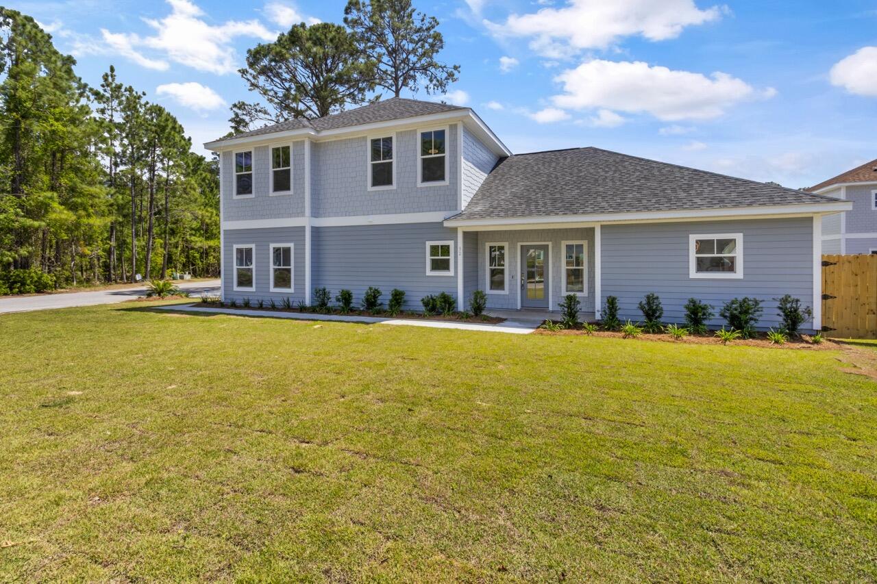 New home just completed. The details and selection of attractive fixtures and premium materials make the quality of this home evident. Construction by a well respected builder with many decades in the area. 4 bedrooms and 4 full baths.Inviting front porch. LVP plank flooring throughout. Wonderful master suite with large walk in closet and custom bath including large walk in tile shower. Beautiful kitchen with quartz countertops, stainless appliances, shaker cabinets and large island. Large garage with storage. 2x6 walls, Impact windows. Hardie siding. Vinyl soffits. A solid and low maintenance home that will be a pleasure to own. This beautiful home is very light and bright with many windows. Full landscaped lot with irrigation.