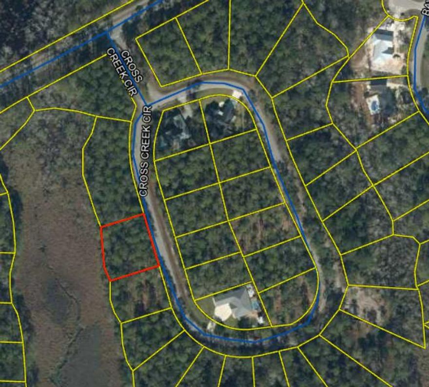 Wooded lot in central Freeport!! Build your dream home on .39 acres with potential for water views of LaGrange Bayou!! Lot is in the Cross Creek Shores development, a safe and quiet neighborhood close to schools, shopping, and dining. Perfect opportunity to buy a lot and build a home in Freeport, FL, the fastest growing city in Florida! Buyer to verify all information in this listing.