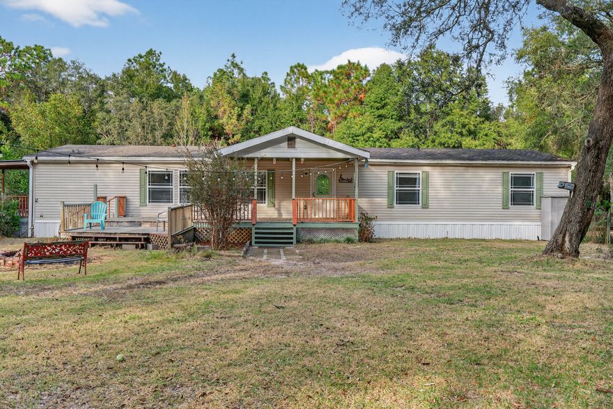 Welcome to 4294 Nap Knob in Holt, FL; a versatile property offering space, functionality, and comfort on 1.76 acres. This well-maintained manufactured home features 3 bedrooms and 2 bathrooms, thoughtfully updated with brand-new LVP flooring, fresh interior paint, updated appliances, a new hot water heater, and a newer HVAC unit. With an acceptable offer, the sellers will provide a new roof, giving added peace of mind.Inside, you'll find an open-concept living area highlighted by a cozy propane fireplace, perfect for relaxing evenings. The spacious primary suite includes a garden tub, separate shower, and double vanity, while the two additional bedrooms offer generous space and well-sized closets. A newer washer and dryer convey with the home for added convenience. Outdoors, the possibilities are wide open. Enjoy the expansive wood deck, gather around the fire pit, or take advantage of the detached shop and carport for projects, storage, or equipment. With 1.76 acres, there's ample room for a homestead, gardening, or simply enjoying the privacy and space around you.

Located with convenient access to I-10, this property provides a balance of rural living and easy connectivity.

Come see the potential this property offer. Your next chapter could start here! 

New Septic drain field - 2021, and new pump control box on well - 2023. 