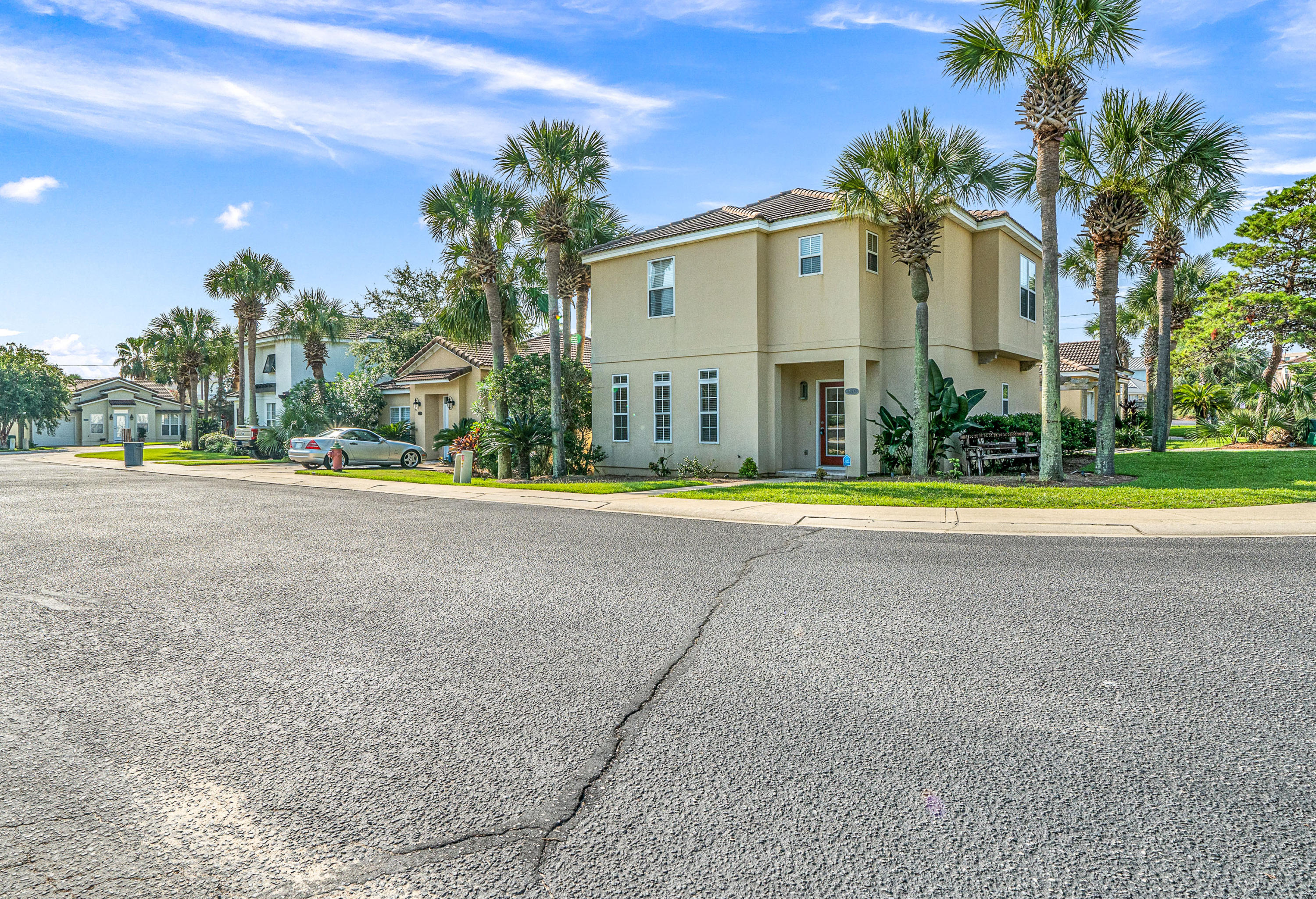 Grab your piece of Tuscany! Just minutes from shopping and sandy beaches, this is a beautifully maintained, Mediterranean-style stucco home with 3 bedrooms and 2 1/2 baths on a corner lot. It offers 2118 sqft on two floors, with the first floor featuring a large open floor plan living and dining area with high ceilings, a screened-in porch, and a spacious kitchen with granite countertops and tile floors. The second floor features the master bedroom in addition to two guest bedrooms with fresh paint and hallway views overlooking the living and dining area below. Tuscany is a quiet, gated subdivision with a community pool and affordable HOA dues at $385 per qtr. No short term rentals allowed.