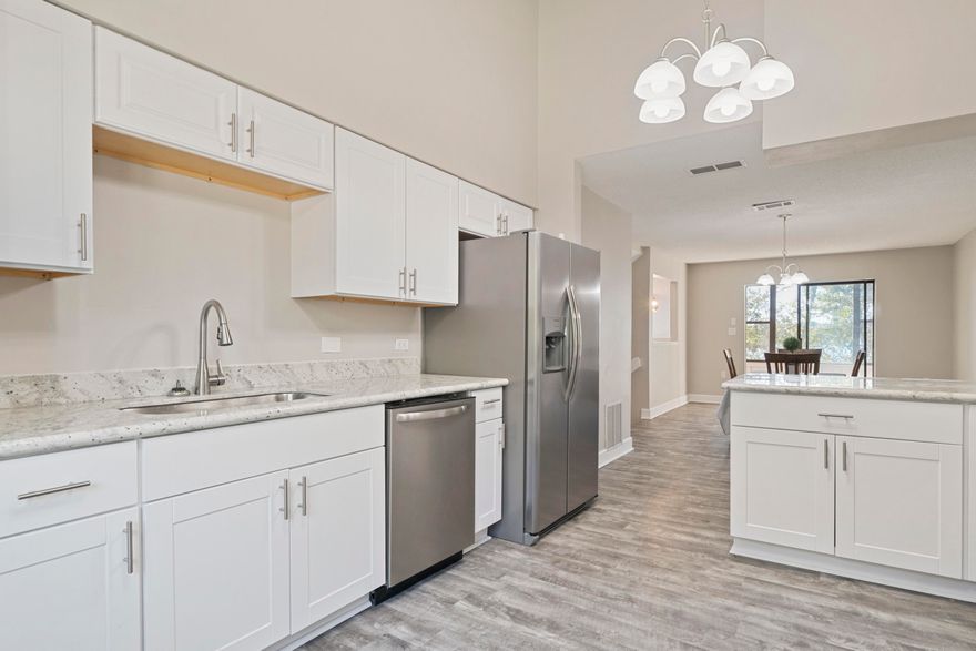 Renovated 3 Bed 2.5 Bath Townhome with Spectacular Water views over the bay - Niceville Blue Water Bay! Enjoy the water views and beautiful sunsets from almost every room. The Kitchen features NEW White Shaker Cabinets, Granite Counter-tops, and Stainless Steel Appliances. The Luxury Vinyl Plank Flooring in living and wet areas ensures low maintenance. Your family will love spending time near the fireplace in the open plan living area. New Bathroom Vanities, toilets, and Fixtures. Enjoy entertaining on the back patio or on enclosed sunroom overlooking the Bay ! This home is Move In Ready. NOTE living room slide door NEW Glass on order