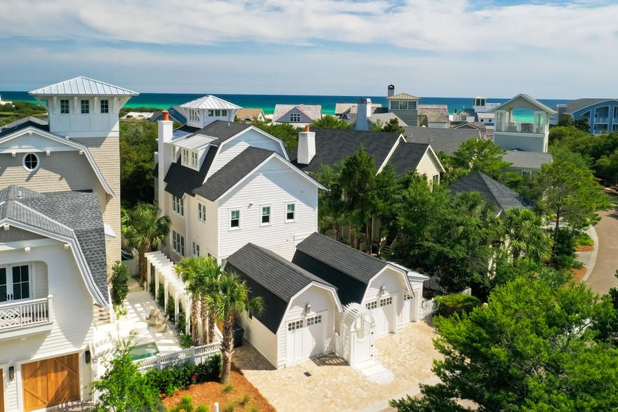 Few homes capture the essence of ultra-luxury coastal elegance as effortlessly as 29 Tidal Bridge Way, a masterpiece nestled in the prestigious WaterSound Beach community along Florida's iconic 30A. This residence, steps from over a mile of gated secluded beach, is a testament to refined design and unparalleled serenity. With a private pool, spa, elevator and garages for two cars plus an LSV, this home anticipates every desire.Crafted with visionary precision by Stackable + Mracek Design Group and brought to life by the masterful builders at Corestruction, this three-story retreat is a harmonious blend of timeless architecture and contemporary sophistication. The interiors, curated by Bella Beach Interiors, elevate every space with a well-chosen palette of textures and tones. From the moment you step inside, impeccable craftsmanship and fine finishes set a tone of understated grandeur.

Spanning nearly 3,300 sq ft with four bedrooms, three full bathrooms, two half baths and a first level flex space, the home is designed for both intimate family moments and grand entertaining. A private elevator seamlessly connects all three floors, ensuring effortless living. The first floor offers three bedrooms and a versatile living space with a kitchenette, evoking the charm of a private carriage house. The second floor is a triumph of open-concept design, where the living, dining, and kitchen areas flow together with effortless grace. The kitchen, a showpiece in its own right, is a chef's dream.  Marble surfaces and backsplash gleam with sophistication, while hand-hewn oak beams lend a warm, grounded elegance. Expansive balconies on every level invite al fresco living, with a summer kitchen off the main living area perfect for sunset soir??es.

The third floor is nothing short of a sanctuary. The master suite, crowned by a soaring cupola that floods the space with natural light, is a study in architectural brilliance. The primary bathroom is a haven of indulgence with seamless glass, marble-laden shower and walls, makeup vanity, and a soaking tub that promises serene evenings. Step onto the third-floor balcony, where a two-person chaise lounge awaits an idyllic perch to savor the day's end with exemplary Gulf views.

It's not merely a residence; it's a legacy and a rare opportunity to claim a piece of the Gulf Coast's most coveted coastline. At 29 Tidal Bridge Way, luxury isn't just lived; it's felt, in every thoughtfully designed detail and every breathtaking view. For those who seek the pinnacle of coastal living, this is your invitation to own the extraordinary.
 
