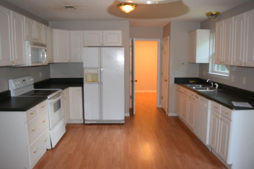 REO This home is located on cul-de-sac south of I-10, about a 20 minute drive from Eglin AFB. Perfect for military family. Convenient to I-10 as well as local shopping and business district. Features large kitchen and dining area, indoor laundry, and ceiling fans in living room and all bedrooms. New carpet and interior has been painted. Exterior features include sprinkler system w/timer, gutters, and rear deck great for grilling out. Green belt backs up to property for extra privacy. Call to take a look today.
