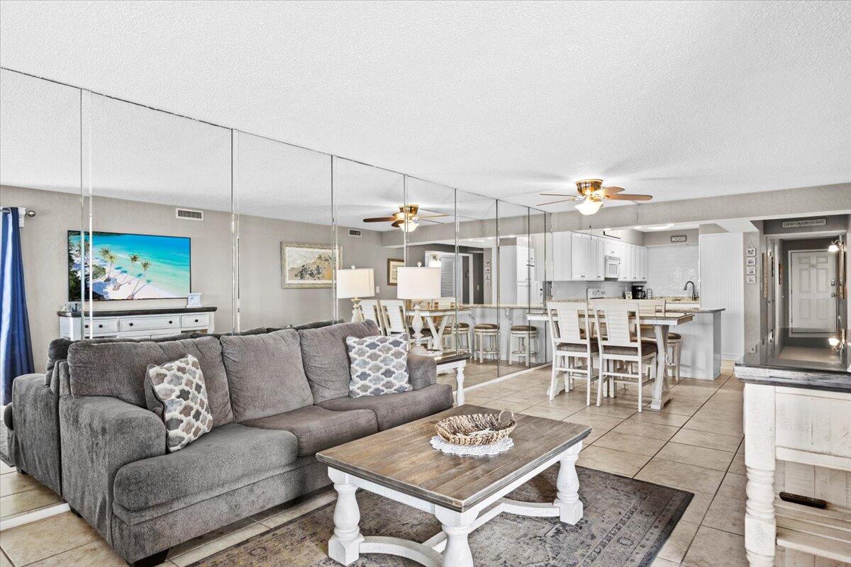 Experience beachfront living at its best in this beautifully updated, fully furnished 3-bedroom, 2-bath condo in Panama City Beach. Perched on the 10th floor, this coastal retreat offers tile flooring throughout, a modern kitchen with quartz countertops and soft-close cabinetry, and a spacious living area that opens to a private balcony with stunning panoramic Gulf views. The master suite also features balcony access and an upgraded en-suite with a tiled walk-in shower. Move-in ready and tastefully decorated with quality coastal furnishings, this unit combines comfort and style. Community amenities include two beachfront pools, a hot tub, fitness center, game room, picnic areas, and direct access to the sugar-white sands--all within a gated complex with 24-hour security. Ideally located near St. Andrews State Park, top dining spots, and local attractions. Don't miss your opportunity to own a piece of paradise on the Emerald Coast.