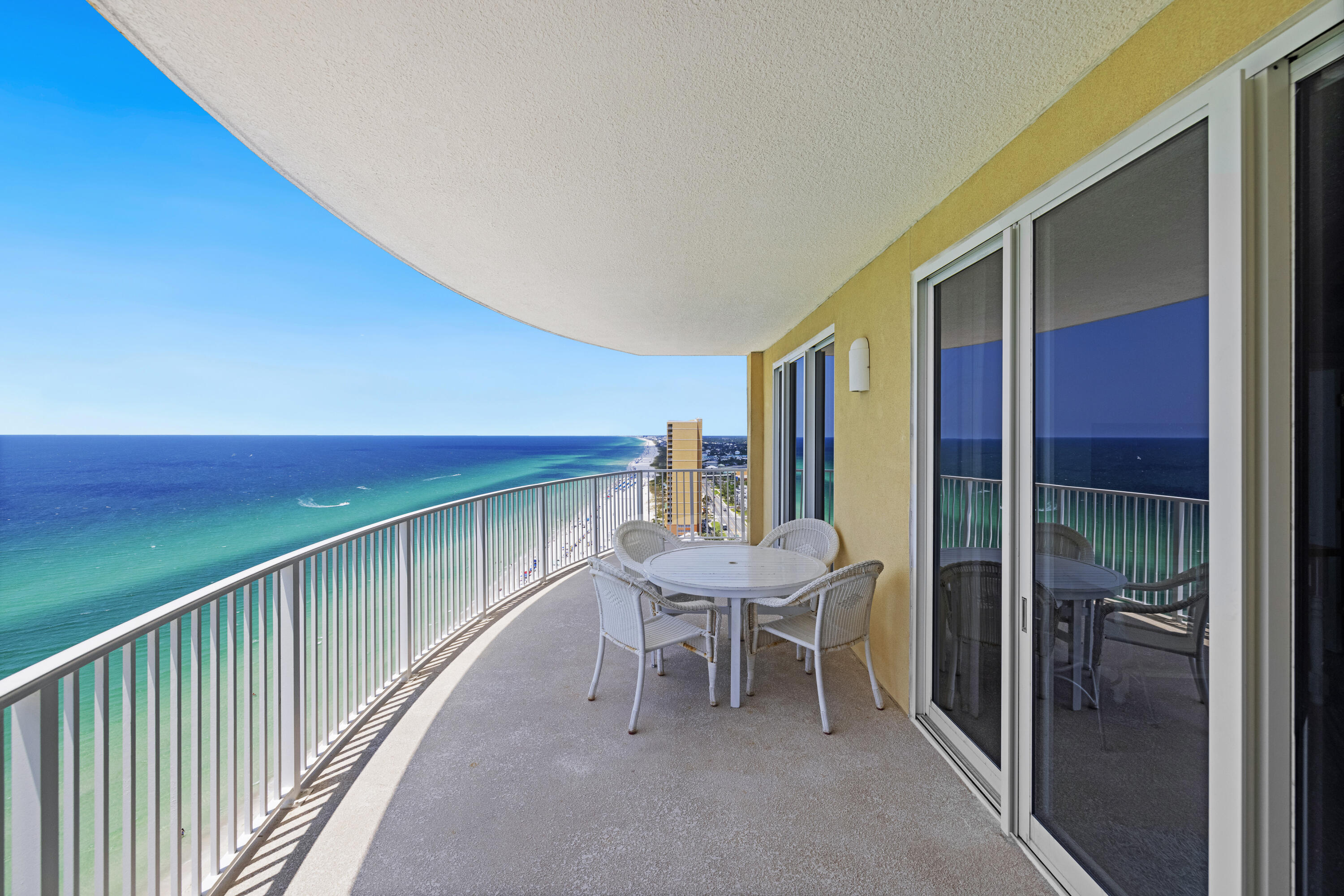 You'll love this fabulous END unit with unobstructed views down the coastline. One of the few units that includes a dedicated parking space! The HOA is one of the best managed on the beach. Discover the epitome of coastal living with this stunning end unit condo at Emerald Isle. Perched on the desirable west end of Panama City Beach, this 2-bedroom haven offers uninterrupted, panoramic views stretching all the way to Destin. Meticulously maintained and never rented, this condo is fully furnished and tastefully decorated, inviting you to step right in and start enjoying the beach lifestyle immediately. Nearly every room, including the guest bedroom, offers mesmerizing views of the beach. Both the living room and master bedroom open onto a huge balcony. Convenience is a hallmark of this property, as it comes with a dedicated parking spot on the gulf side, eliminating the hassle of searching for parking. The complex offers resort-style amenities, including two pools, with one covered and heated for year-round swimming. Stay active and relaxed with access to a fitness room, steam room, and sauna. A community room overlooking the beach is perfect for social gatherings. Owners enjoy complimentary beach chairs and an umbrella from the onsite beach service, making your beach days effortlessly enjoyable. Additionally, this pet-friendly complex welcomes furry friends for owners. This condo is not just a home; it's a gateway to a luxurious and serene beach lifestyle. Whether you're seeking a full-time residence or a vacation getaway, this Emerald Isle gem promises a unique blend of comfort, convenience, and coastal charm. Don't miss your chance to own a piece of paradise!