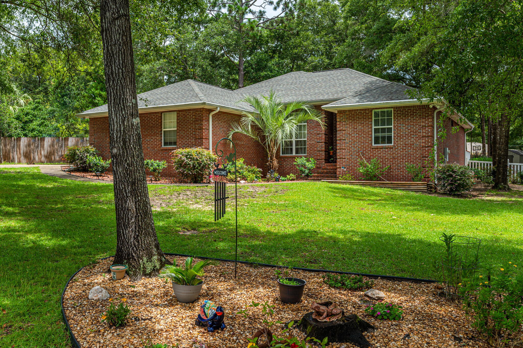 Welcome Home to beautiful Indian Trails Subdivision...this 3 bd/2 ba all brick home features high ceilings with crown molding throughout. Spacious living room boasts a gas fireplace and home has a semi open floor plan. Formal dining can accommodate your larger furnishings. Kitchen features beautiful white cabinetry, breakfast bar and adjoining dining area. Great master suite w/ access from master bathroom to laundry room. More than enough room for all those clothes with an EXTRA LARGE MASTER CLOSET! This split bedroom plan has two additional bedrooms located off of the living room hall w/ spacious additional bathroom. Entertain guests in the enclosed patio w/ adjoining open deck. Nice level fenced back yard w/ nearly new outbuilding (power, wall unit AC and hurricane strap tie downs). Schedule your showing today! Buyer to verify all areas of importance. Complete professional portrait of interiors and backyard to be added 7/30/2022 in the PM.