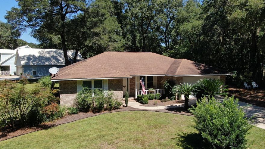 Here is your chance to own in the charming neighborhood of Waterview Cove. This 3 bedroom, 2 bath, all brick, well-maintained home sits on a double lot, making it .44 acres. As you enter the home you will notice the vaulted ceiling in the living room. The master bedroom has a double walk in closet, plenty of space for all your clothes or use one for storage. The far right bedroom has a separate entrance through the screened in porch and its own bathroom. No carpet to pull up in this house, you will find tile floors throughout.  Enjoy your mornings or evenings in the screened in porch. Right across the street is the neighborhood boat launch, bring your paddle boards or kayaks. The yard has been meticulously maintained, with beautiful sago palms, bottle brush plants and azaleas.