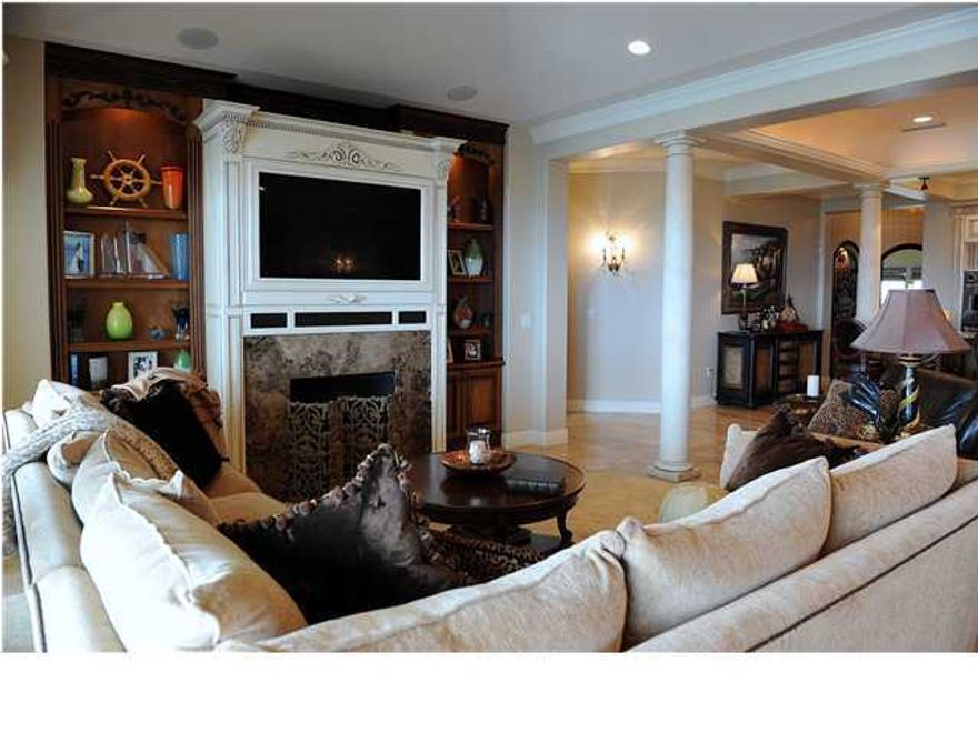 Marbella Condominium Unit Penthouse 1 is an elegant Unit on the Destin Harbor. Located on a 35-foot bluff over-looking the beautiful Destin Harbor, Marbella Condominium is a low-density, private residential community with 69 units. This penthouse is located on the west end of the building on the 9th floor with panoramic views of the Destin Harbor and the Gulf. Decorative features include high ceilings measuring 10', 11', and 12' in height, 7-1/2 foot door heights with 2-1/2'' inch thick wood doors all with frosted glass inserts, custom window treatments in every room, and custom crown molding throughout the unit. Upon entrance, you enter the foyer area with a beautiful Muriel and travertine flooring. You then move toward the large living and kitchen area. The spacious gourmet kitchen