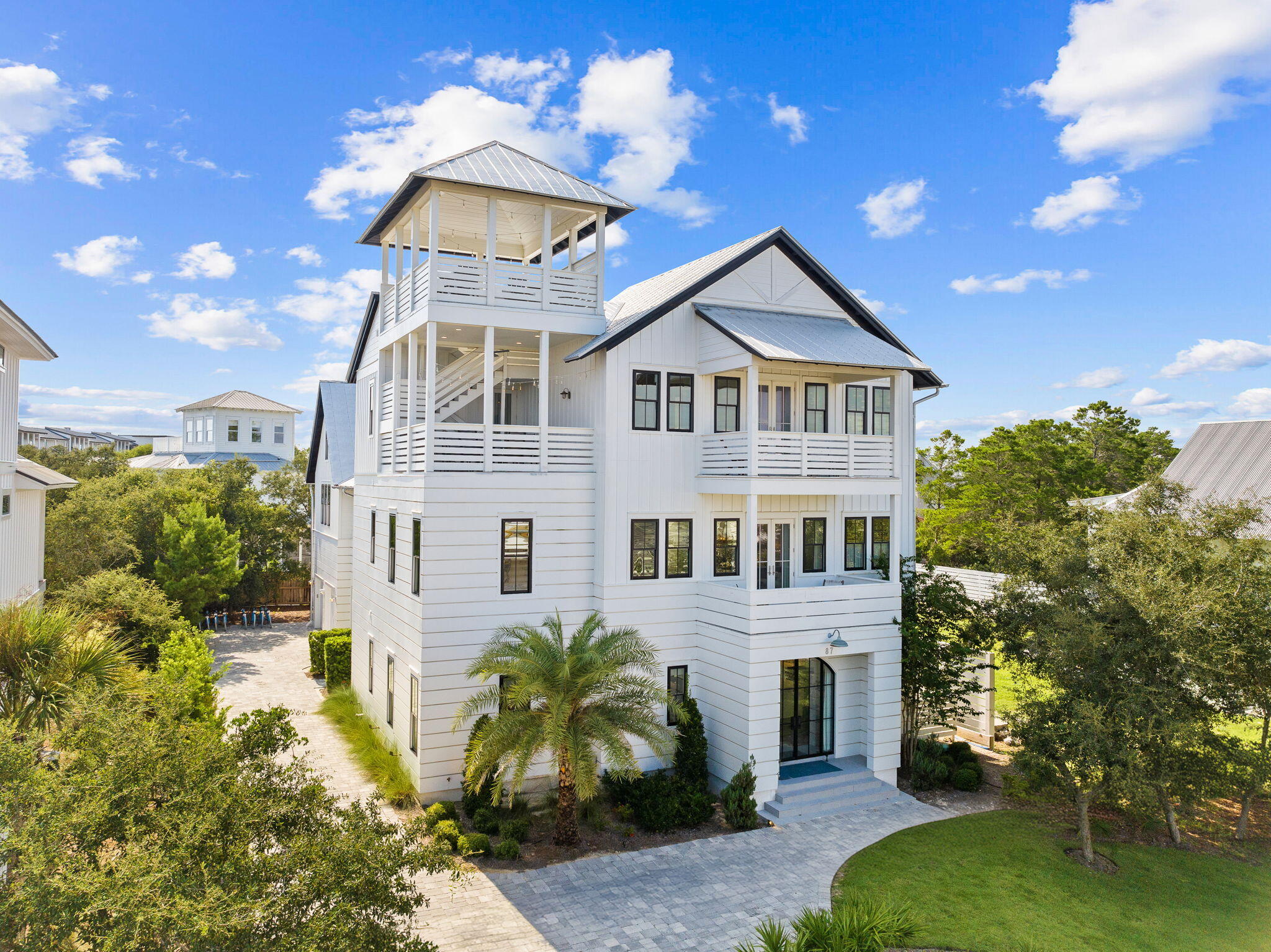 Discover this exquisite custom home on the east end of Scenic Highway 30A in Seacrest Beach, FL. Fully furnished with high-end interiors by the 30A Design Group, this luxurious beach residence offers an expansive lot with an impressive pool deck and generous outdoor living spaces, perfect for enjoying the coastal lifestyle. With projected annual rental revenue exceeding $250K, this property is not only a stunning retreat but also an outstanding investment opportunity.The home features a versatile floor plan with five bedrooms, a bunk room, and a carriage house with an upper loft, providing ample space for large family gatherings or optimizing rental potential. Two spacious master suites make it ideal for accommodating multiple families. Located at 87 Seacrest Drive, this property is perfectly positioned between Alys Beach and WaterSound, with dining, entertainment, and shopping just a short golf cart or bike ride away. With beach access only 1/3 mile from your front door, this home is an exceptional opportunity, whether as a second home or an investment property on 30A.