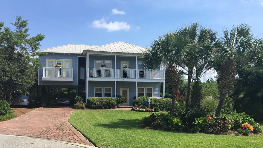 This private beach retreat is truly a quiet hidden gem along the east end of 30A in the 6 home community of Tranquil Shores, which features a newly updated Community Pool shared by only these 6 homes and Deeded Beach Access directly across the street and public beach access a block to the west. Beautifully furnished and updated this reverse plan offers a top floor open living/kitchen & dining area with a large kitchen island, custom built-in cabinetry, fireplace, shelving, queen sleeper sofa and full bath. The master bedroom and spacious master bath have 2 closets, one a large walk in, dual vanities with knee space, large tiled spa shower with built-in seat and separate commode area. Enjoy a peak at the gulf from the living/dining and master bedroom with balconies off of both rooms. Downstairs features 3 additional bedrooms and 2 baths.  The front   bedroom is a mini studio, with a kitchen area with full size refrigerator, microwave and cook top.  This allows for rental as two units with separate access to each if desired.  There are separate outdoor stairs to the 2nd floor with access to the 1st floor thru the front door or carport.  The upstairs sleeps 4 with a king master suite and bath and living room with queen sleeper and  full bath.  The downstairs sleeps 9.  One of the downstairs bedrooms has bunk beds with a twin over full with full size trundle bed and ensuite bath for the kids.  The second downstairs bedroom has a king bed with bath that also opens to the hall and the third room features a daybed with trundle and kitchenette.  A sunny southern front exposure makes for a light and bright beach living and the back and side yards are very private with a custom shed to match the house, which is perfect for bikes, paddle boards, kayack's and Beach equipment.  A large wooded preservation area allows for lots of privacy.  Quick easy access to the Watersound Parkway 1/2 mile to the east gets you to the grocery, Pier Park and Destin.  Although this home has never been on a rental program 4 out of the 6 homes are very popular short term rentals making this home an excellent second home and investment.