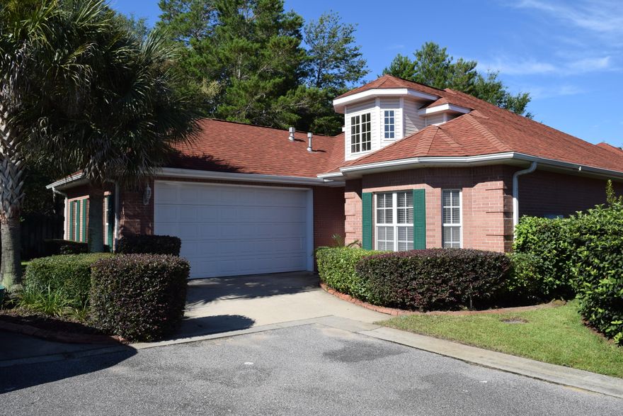 ONE OWNER ALL BRICK Patio home tucked away in the Mediterranean Village area of gated Magnolia Plantation in Bluewater Bay. This home has a tiled entry with raised ceilings, abundant windows, smooth finishes, 9' ceilings and crown molding throughout. Formal dining room off to the right of entry with a beautiful architectural coffered ceiling. Kitchen is open to the living room and features Hard surface counter-tops, custom cabinetry, pantry and a wrap around breakfast bar. Off of the kitchen is a wet bar with lots of cabinet space for entertaining.Living room is spacious with recessed lighting and features a gas fireplace with decorative built in shelving on either side. Split bedroom floor plan with Master bedroom featuring a beautiful tray ceiling and Master bath with large