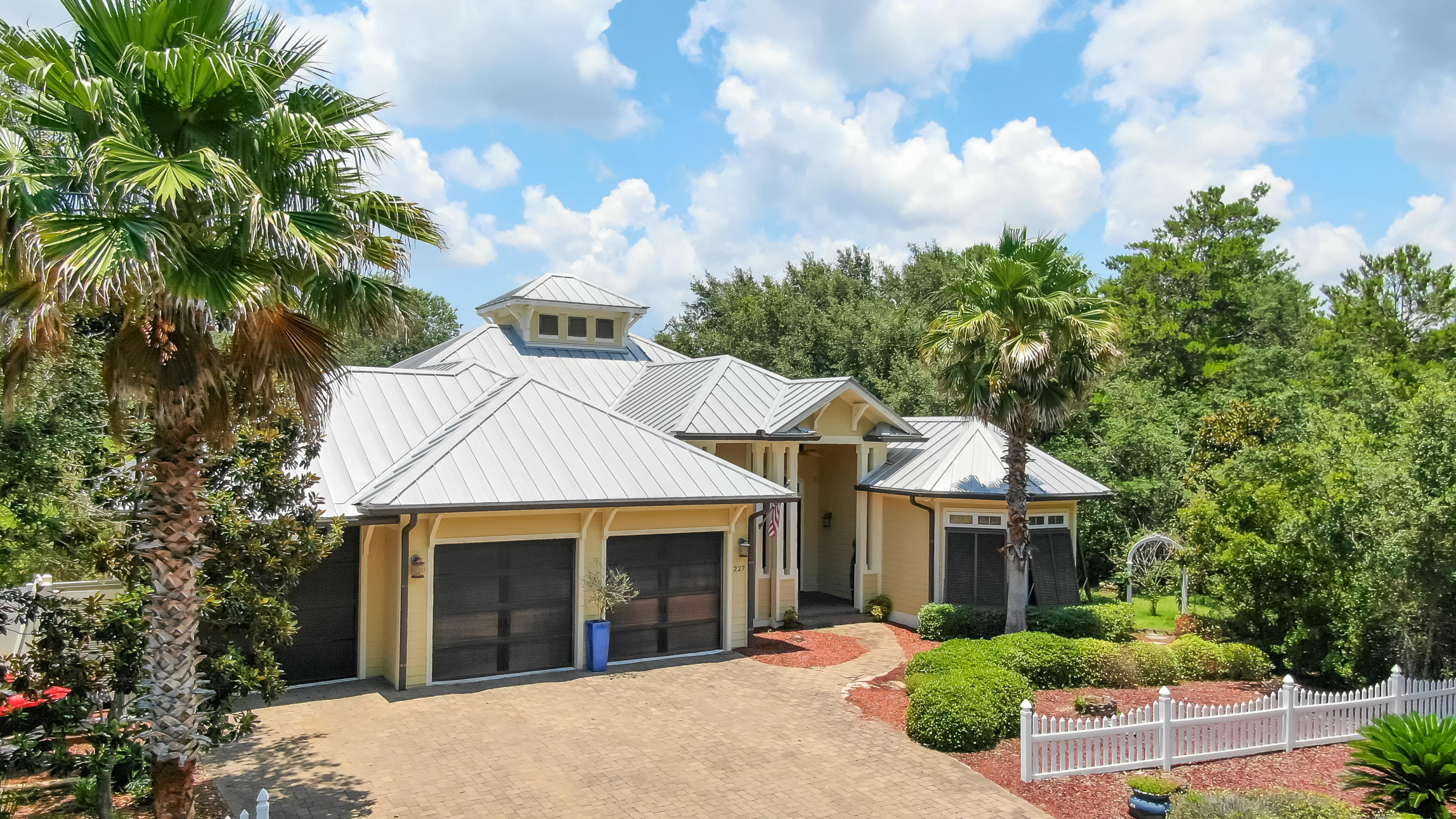 This stunning single-story home in the beach close community of Seabreeze will not disappoint you. Extraordinary 8-foot mahogany double entry doors set the tone for what is to come in this exceptional remodeled home. Upon entering you are greeted by vaulted ceilings and stunning hardwood floors which run throughout the main living areas accentuating the warmth of the home.Custom built-ins flank the stacked-stone fireplace and trey ceilings set the tone in the living area, which flows into to the dining area, kitchen, and wet bar. French doors leading to the large saltwater pool with lanai. The outdoor dining area nestled against the natural stone-front gas fireplace and outdoor wet bar create the ultimate indoor-outdoor setting.The spacious kitchen features a large walk-in pantry