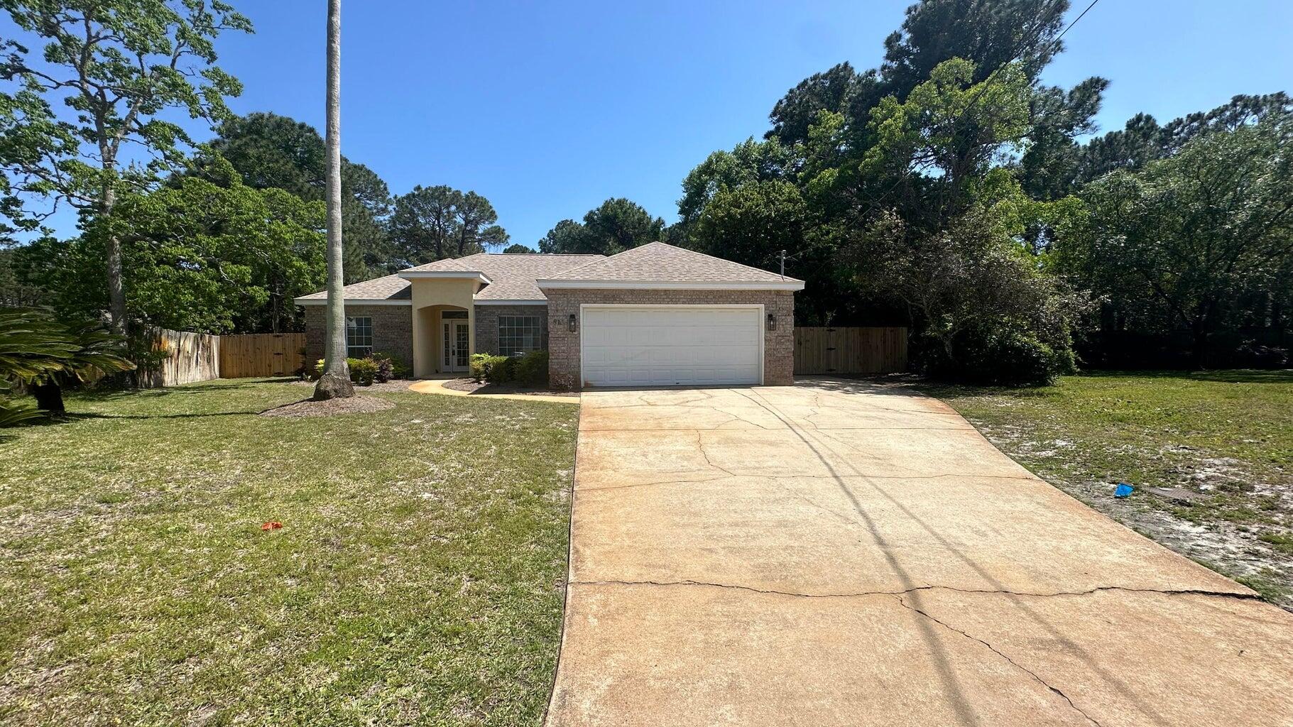 Discover your dream home in the heart of Miramar Beach, at one of a kind and harmonious neighborhood  BAY BRIDGE LANDING! This charming 3-bedroom, 2-bathroom brick home features an inviting open split floor plan designed for modern living and convenience. The spacious island kitchen is perfect for cooking and entertaining, while the primary bathroom boasts a luxurious his-and-hers sink setup, generously-sized bedrooms offering comfort and privacy for all family members or guests.Step outside to enjoy a large fenced backyard, ideal for outdoor activities, gardening, or simply relaxing in your private oasis. The property also includes a 2-car garage, a new water heater, and a roof replaced in 2017 for added peace of mind. Enjoy exclusive access to the community's private boat launch and pool area, offering endless opportunities for aquatic adventure and leisurely swims under the sun.

Don't miss out on this incredible opportunity to experience luxury living coupled with community amenities that elevate the standard of living. Schedule your viewing today and make this your forever home!