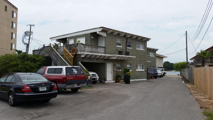 Great waterfront property on Okaloosa Island across the street from the beautiful white sand beach and Gulf of Mexico. All units have a fantastic view of the Intercoastal Waterway from patio, living room and master bedroom and there is a dock. Property consists of a single family home with approximately 2008 SF and 4 units approximately 784 SF each. Each unit is 2 bedrooms and 1 bath with a large patio to enjoy waterfront living. Rental income as follows: Unit 1 $1025-7/31/17, Unit 2 $1050-3-31-17, Unit 3 $1095-6/30/17,Unit 4 $975-12-31-16,Unit 5 (house) $1525-1/31/17 with the scheduled income of $54,900.. New buyer will have to honor all leases and keep the property with current management company until leases are up. Property is being sold ''AS IS'' with the right to inspect.