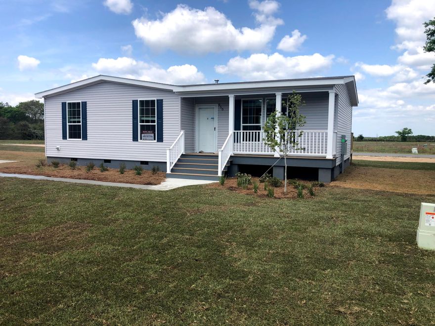 High quality stick built modular home community.  Homes framed with 2x6 studs and 2x10 #1yellow pine floor joists with crawl space and solid continuous concrete, steel reinforced, foundation.  Walk in from your front porch to an open Living Room/Kitchen/Dining area with continuous luxury vinyl plank flooring.  All new stainless steel GE appliances are included in this charming 3 bedroom two bath home.  The primary bedroom has a walk in closet and the primary bathroom has a 60' separate shower and garden tub with Double vanities with framed mirrors above.  Double paned windows, shield-tech roof decking, and R-30 insulation make this home energy efficient.  Lot is  1/4 acre and has underground electric, Argyle Water System, septic tanks, paved roads, 6 miles from town.