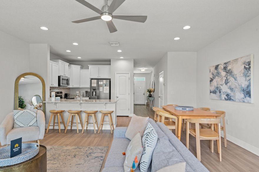 The BEST PRICED and the BEST LOOKING 3/2.5 Townhome in PCB built in 2019! Welcome to your future Smart Home! This townhome is like new inside and out. It comes Tastefully Furnished & Rental Ready with Amazing Projected ROI. Search on YouTube the full property address for video tour. STR & LTR allowed. Highlights: Stainless steel appliances, Beautiful Back Splash and granite counter tops in the kitchen and baths, Cute Modern-Coastal furniture and accessories, one car garage + 4 driveway spaces, short 2 min walk to the pool, a short 7 min drive to the beach, restaurants, nightlife, grocery stores, Gulf Coast College, Sports Complex and more. VA & FHA approved! A smart home package is included with the home with Ring doorbell camera, motion sensor and a touch panel for easy access to the thermostat and security system. HOA includes outside insurance ground keeping, pool, trash pick up. The majority of the HOA fee covers the outside insurance. All info believed to be correct, buyer must verify if important