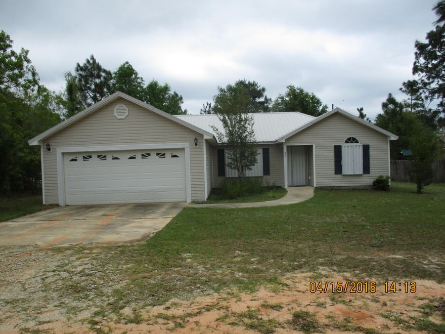 LOOKING FOR A GREAT BUY? THIS HOME IS LIKE NEW AND MOVE IN READY! HOME OFFERS A LARGE OPEN KITCHEN - DINING - LIVING ROOM FLOOR PLAN. KITCHEN INCLUDES TONS OF CABINETS, ALL THE APPLIANCES AND ALSO A BREAKFAST BAR PERFECT FOR ENTERTAINING. THE KITCHEN IS OPEN TO THE DINING AND LIVING ROOM WHICH GIVES THE PERFECT ABILITY FOR TONS OF FAMILY TIME. HOME HAS A LARGE MASTER SUITE, SPLIT FLOOR PLAN WITH 2 ADDITIONAL BEDROOMS WITH A LARGE SECOND BATH. HOME HAS TILE AND NEW CARPET THROUGH OUT HOME, ALL PAINT THROUGHOUT THE HOME IS IN PERFECT CONDITION, AND ALL NEEDED IS YOUR FURNITURE AND CLOTHES! HOME INCLUDES HURRICANE SHUTTERS ALREADY INSTALLED, A 2 CAR GARAGE, GREAT LAUNDRY ROOM, ATTIC STORAGE IN GARAGE, PAVED DRIVE, NICE OUTSIDE DECK IN BACKYARD AND GREAT YARD!